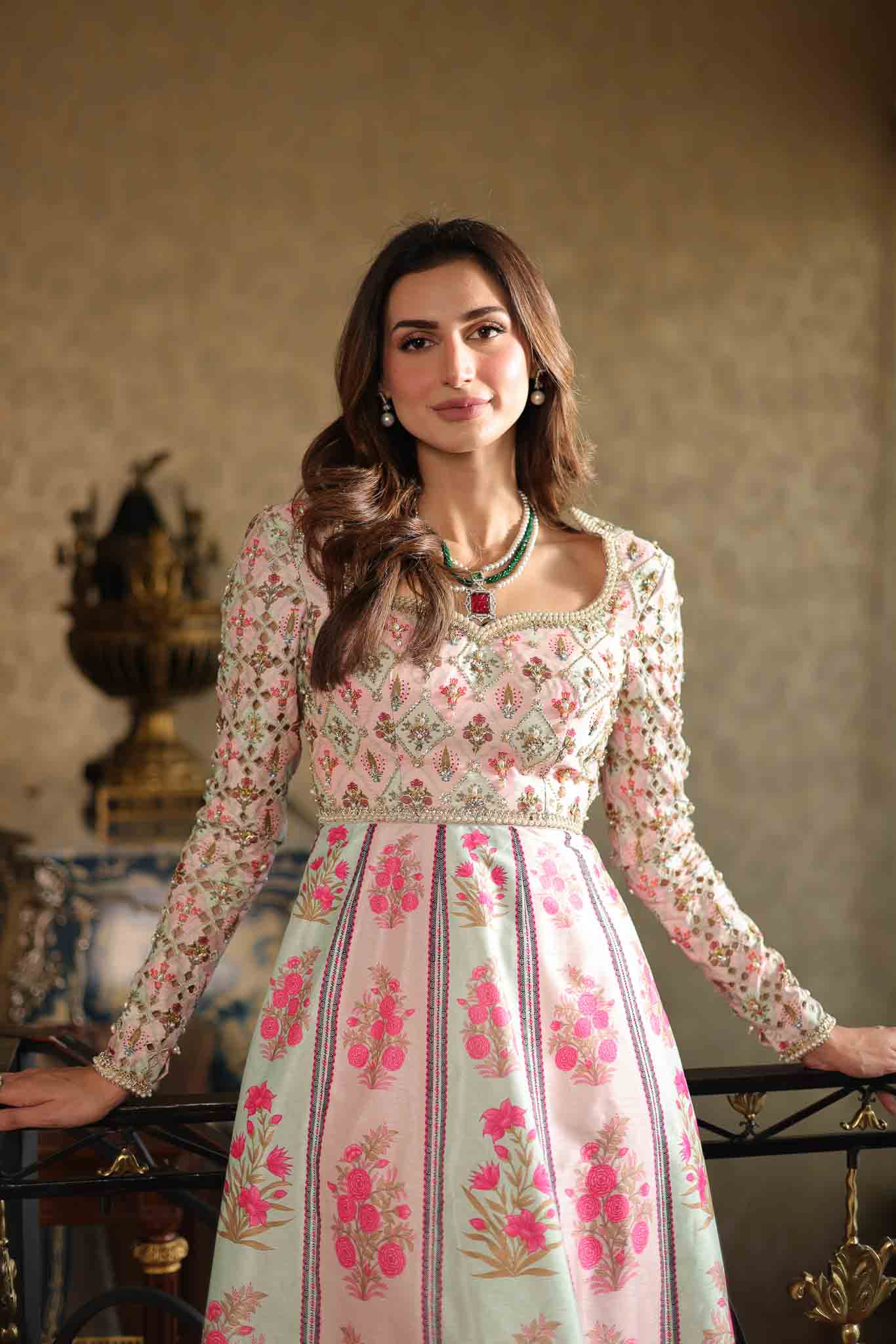Model wearing pastel pink and ivory floral printed long dress from Mysie By Tahira's Gulabo, Pakistani Luxury pret and clothes online in UK.