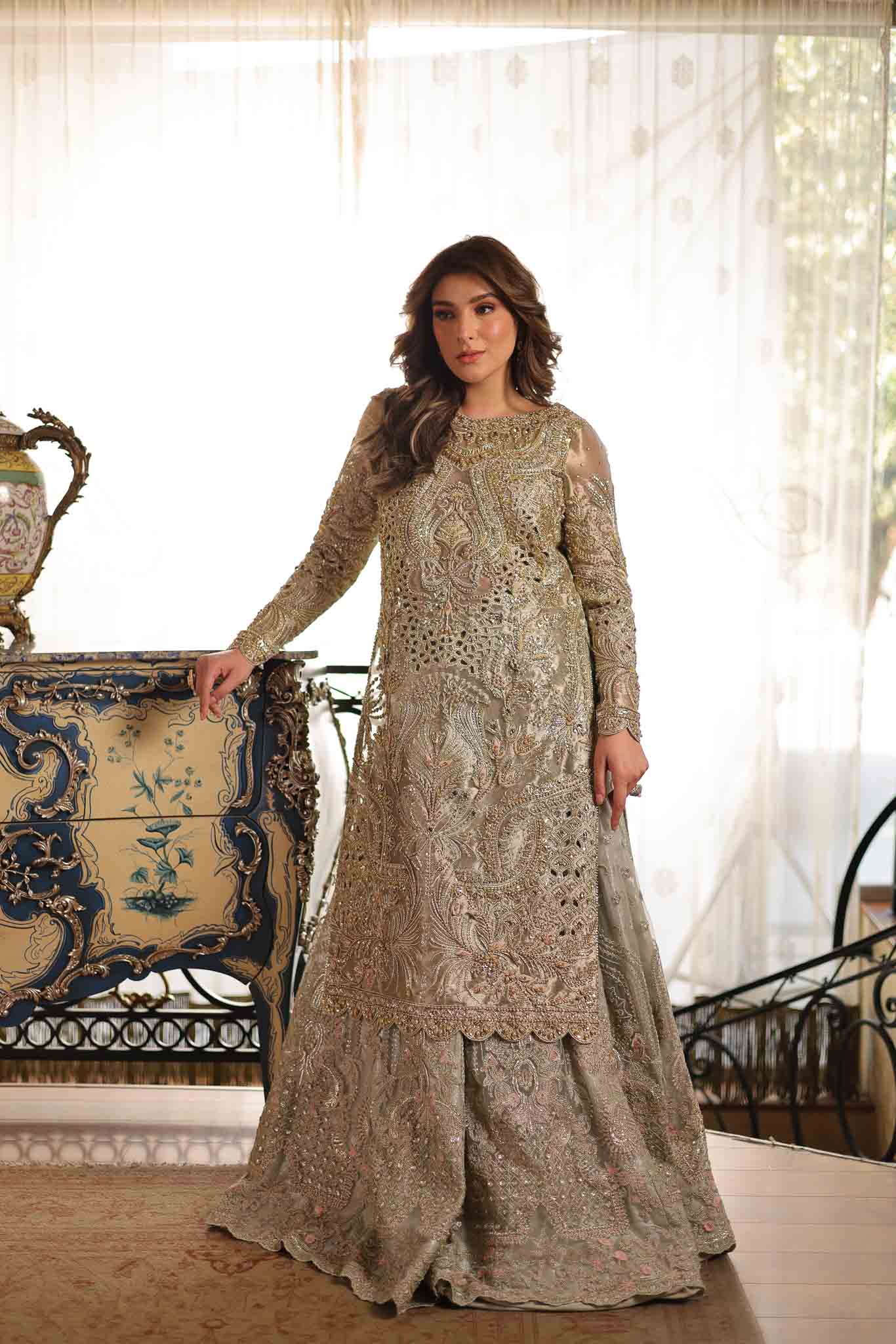 Model wearing soft beige embellished formal dress from Mysie By Tahira's Saffron, Pakistani Luxury pret available online in UK.