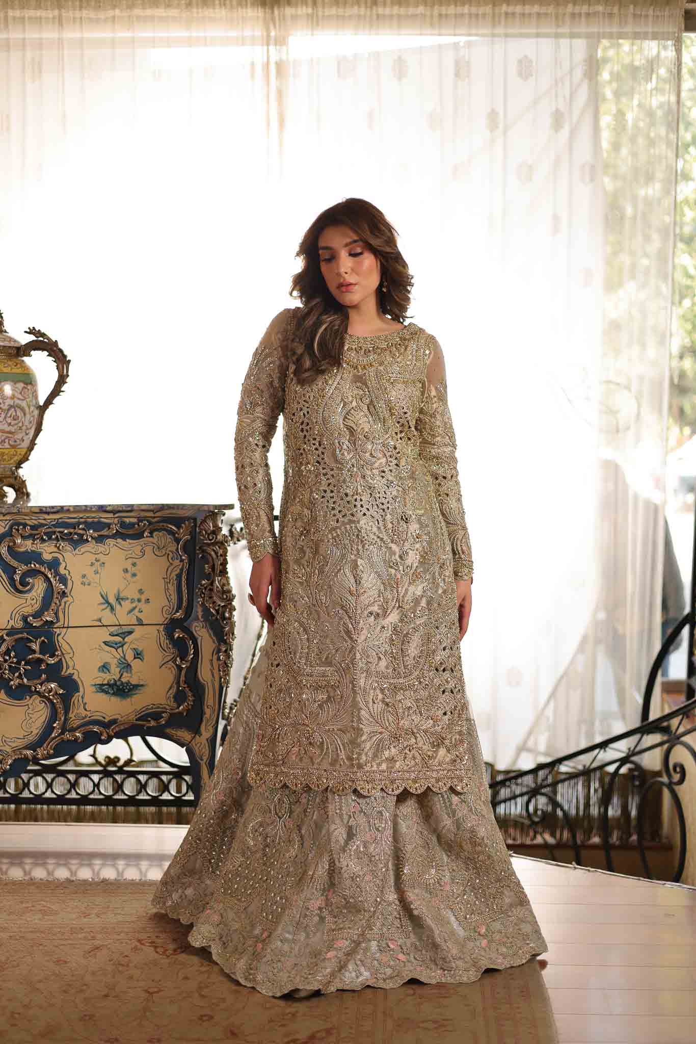 Model wearing soft beige embellished formal dress from Mysie By Tahira's Saffron, Pakistani Luxury pret available online in UK.