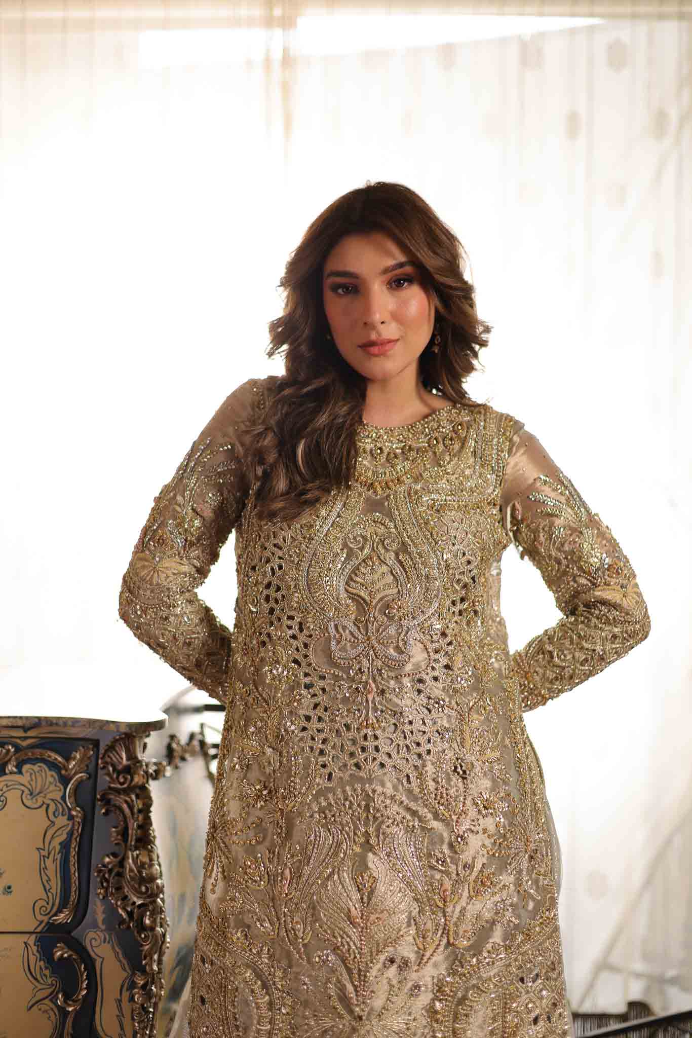 Model wearing soft beige embellished formal dress from Mysie By Tahira's Saffron, Pakistani Luxury pret available online in UK.
