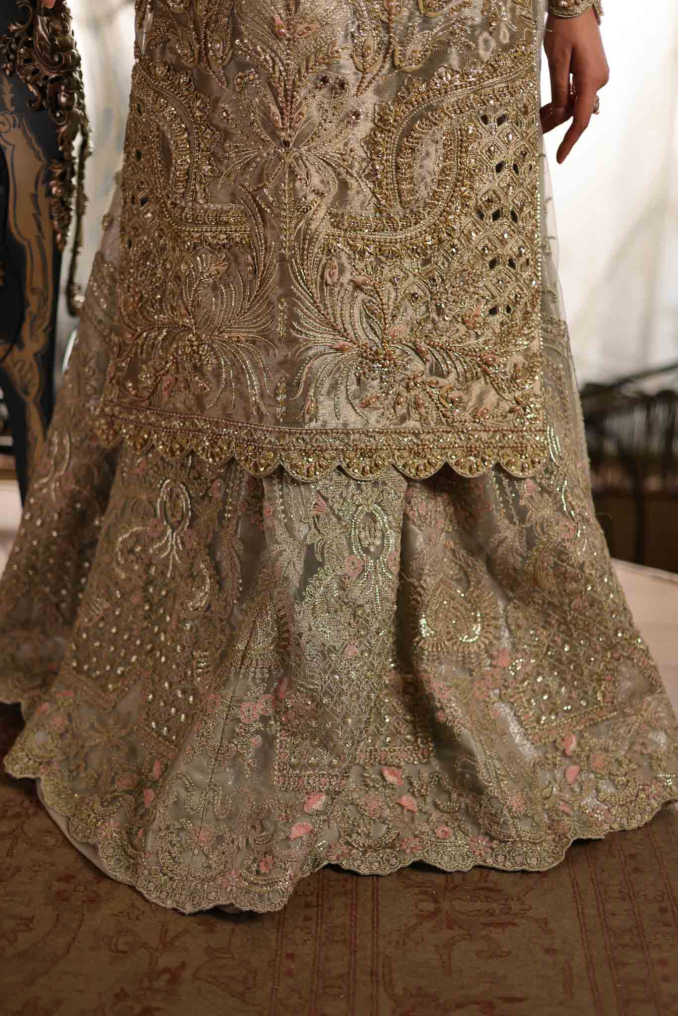 Model wearing soft beige embellished formal dress from Mysie By Tahira's Saffron, Pakistani Luxury pret available online in UK.