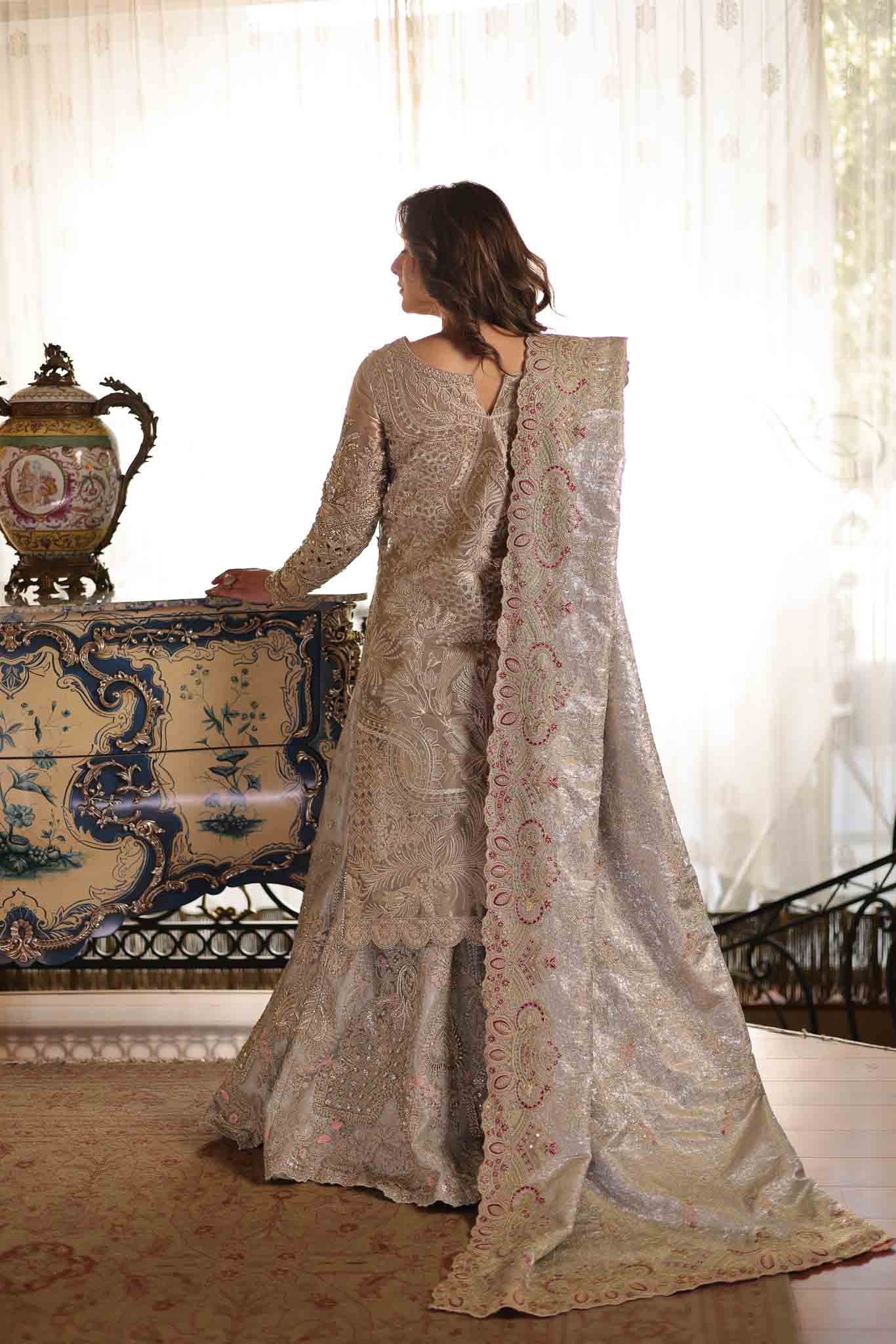 Model wearing soft beige embellished formal dress from Mysie By Tahira's Saffron, Pakistani Luxury pret available online in UK.