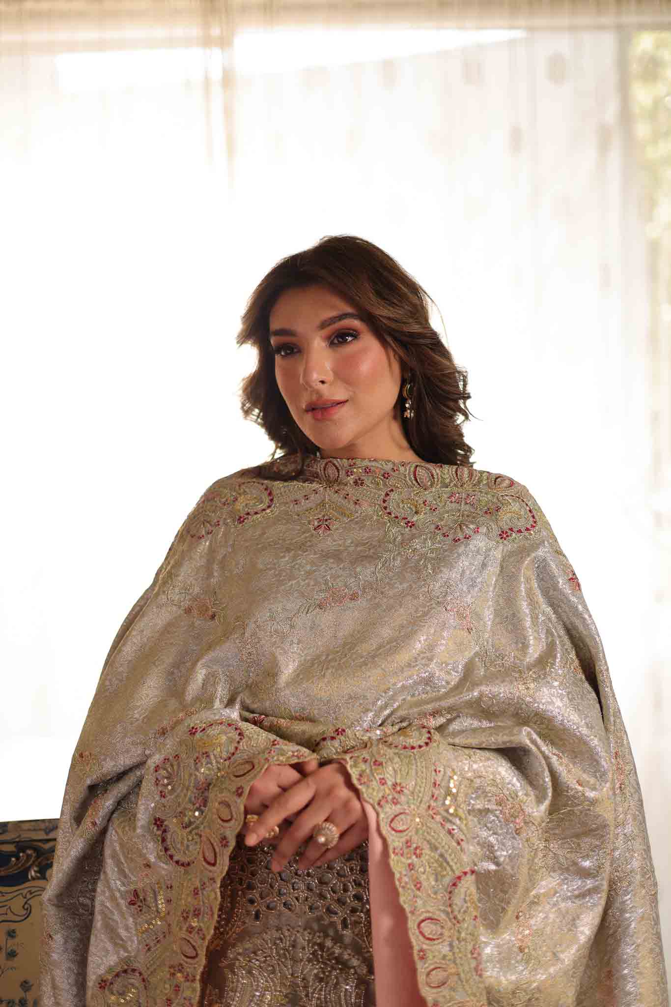 Model wearing soft beige embellished formal dress from Mysie By Tahira's Saffron, Pakistani Luxury pret available online in UK.