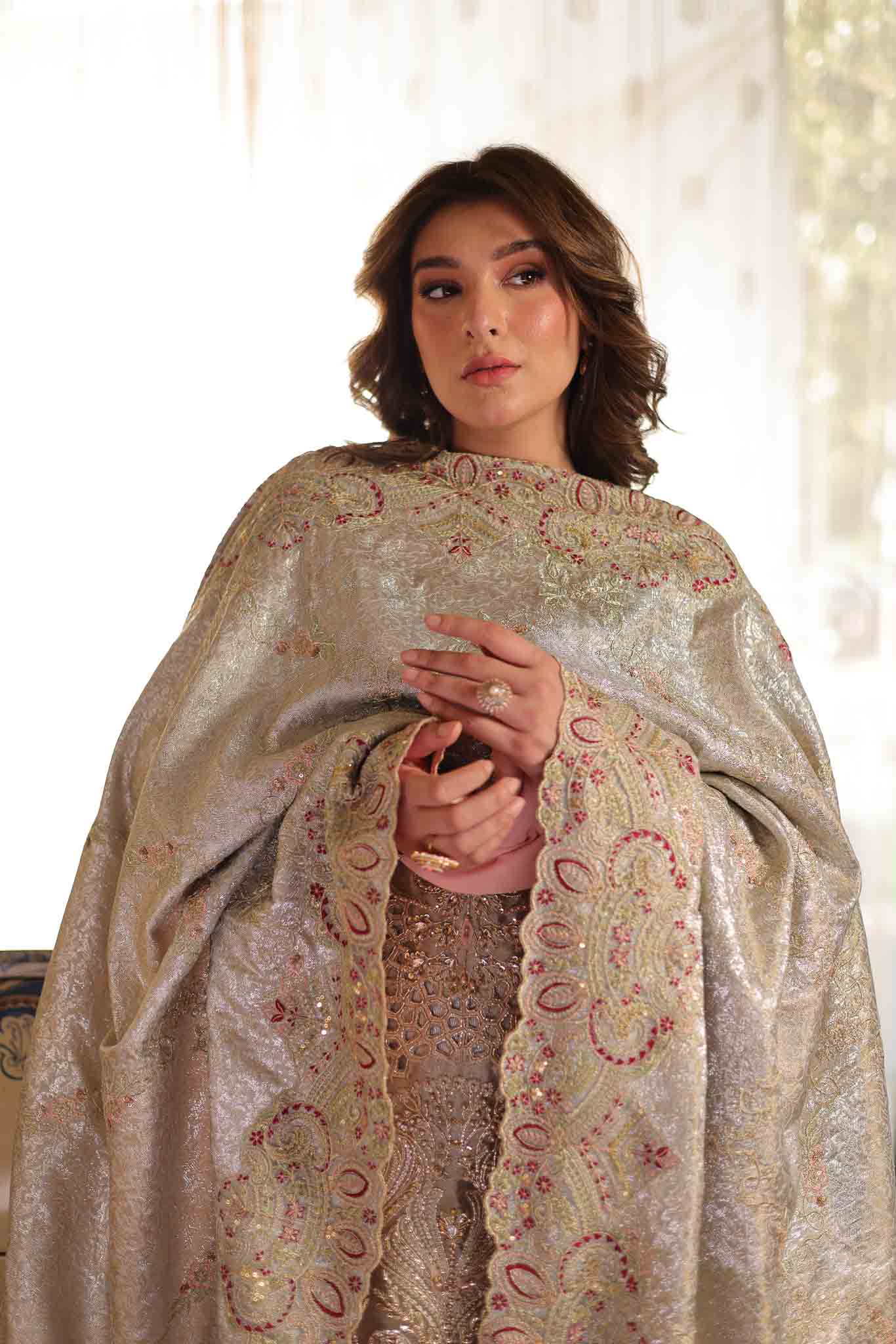 Model wearing soft beige embellished formal dress from Mysie By Tahira's Saffron, Pakistani Luxury pret available online in UK.