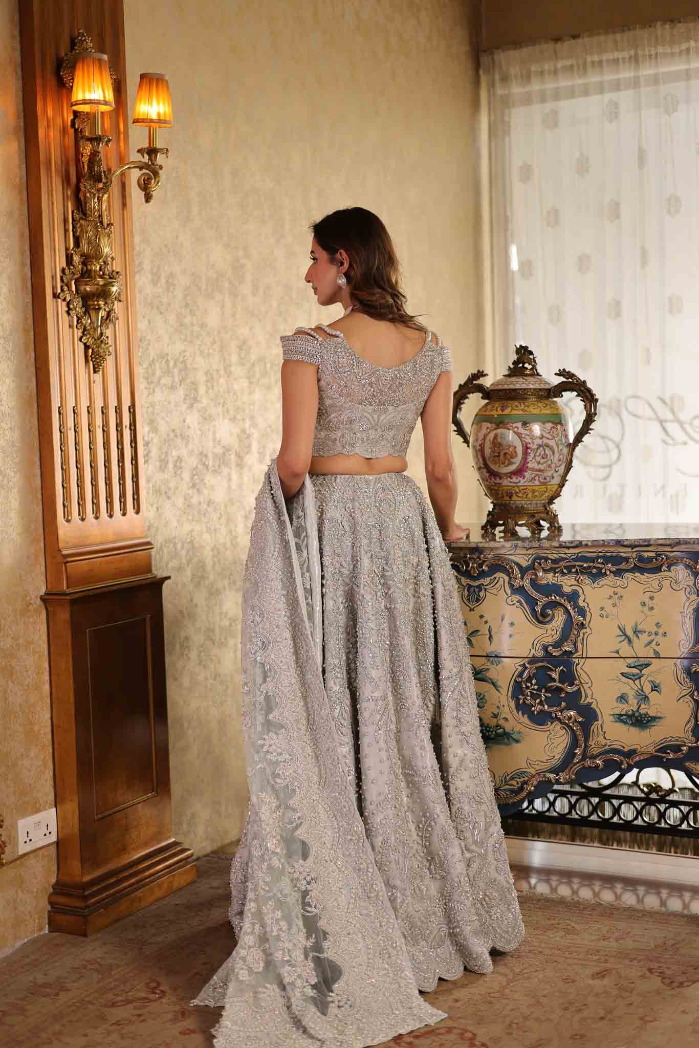 Model wearing silver embellished formal dress from Mysie By Tahira's Mia, Pakistani Luxury pret available online in UK.