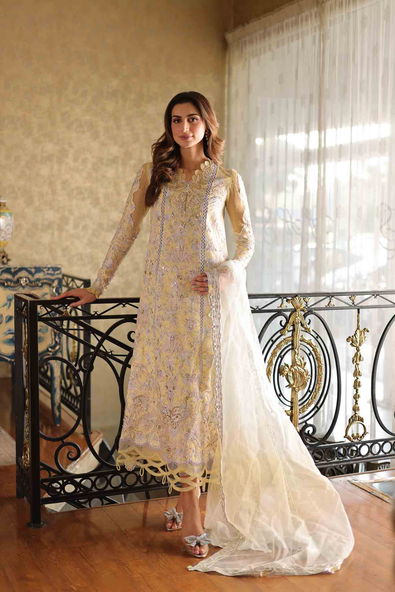 Model wearing pastel yellow embroidered long shirt with ivory dupatta from Mysie By Tahira's Tulip, Pakistani Luxury pret in UK.