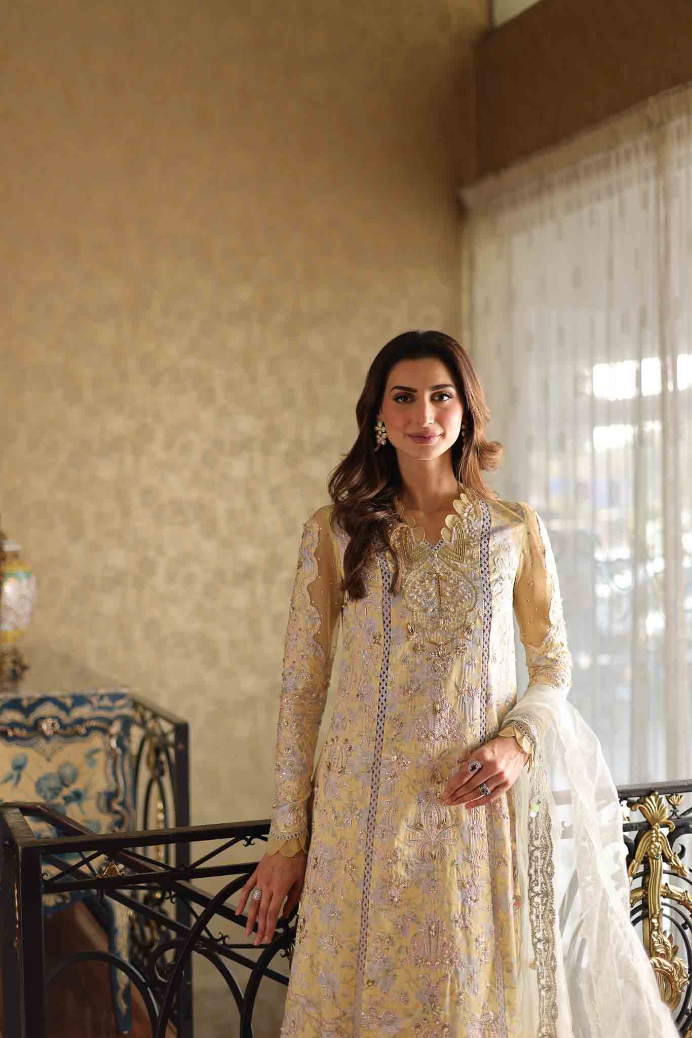 Model wearing pastel yellow embroidered long shirt with ivory dupatta from Mysie By Tahira's Tulip, Pakistani Luxury pret in UK.