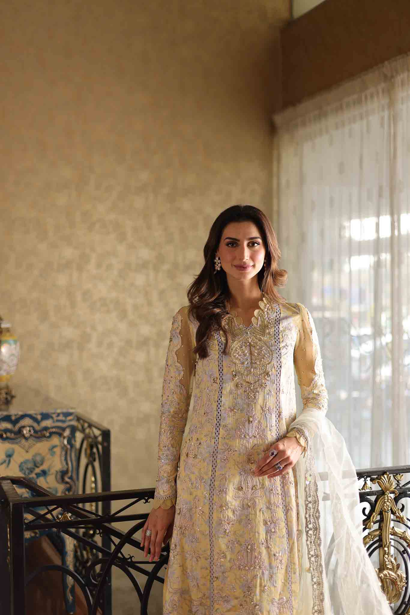 Model wearing pastel yellow embroidered long shirt with ivory dupatta from Mysie By Tahira's Tulip, Pakistani Luxury pret in UK.