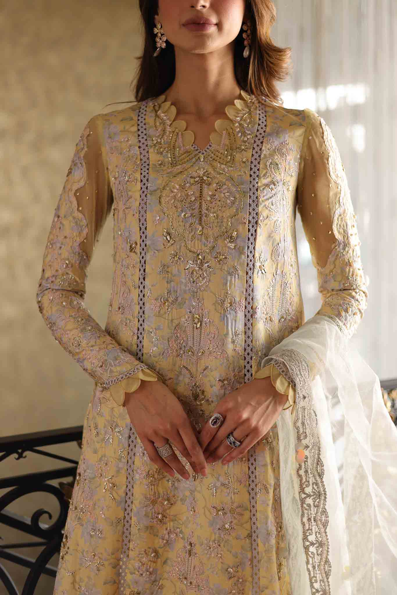 Model wearing pastel yellow embroidered long shirt with ivory dupatta from Mysie By Tahira's Tulip, Pakistani Luxury pret in UK.