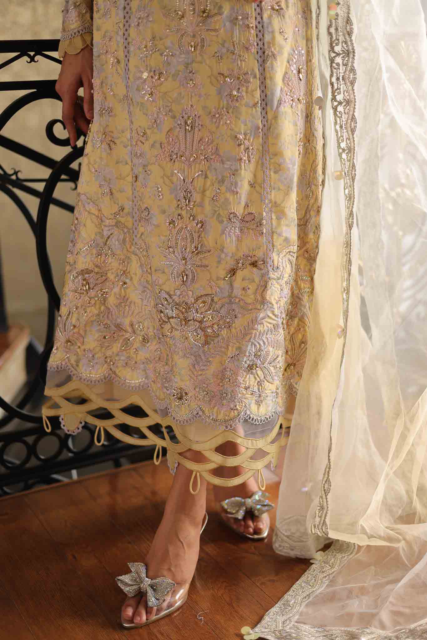 Model wearing pastel yellow embroidered long shirt with ivory dupatta from Mysie By Tahira's Tulip, Pakistani Luxury pret in UK.