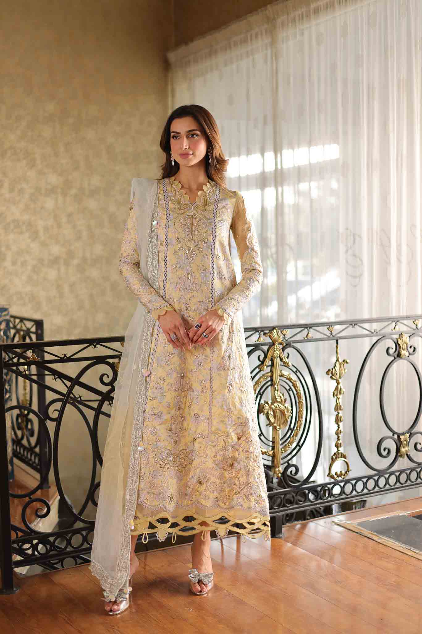 Model wearing pastel yellow embroidered long shirt with ivory dupatta from Mysie By Tahira's Tulip, Pakistani Luxury pret in UK.