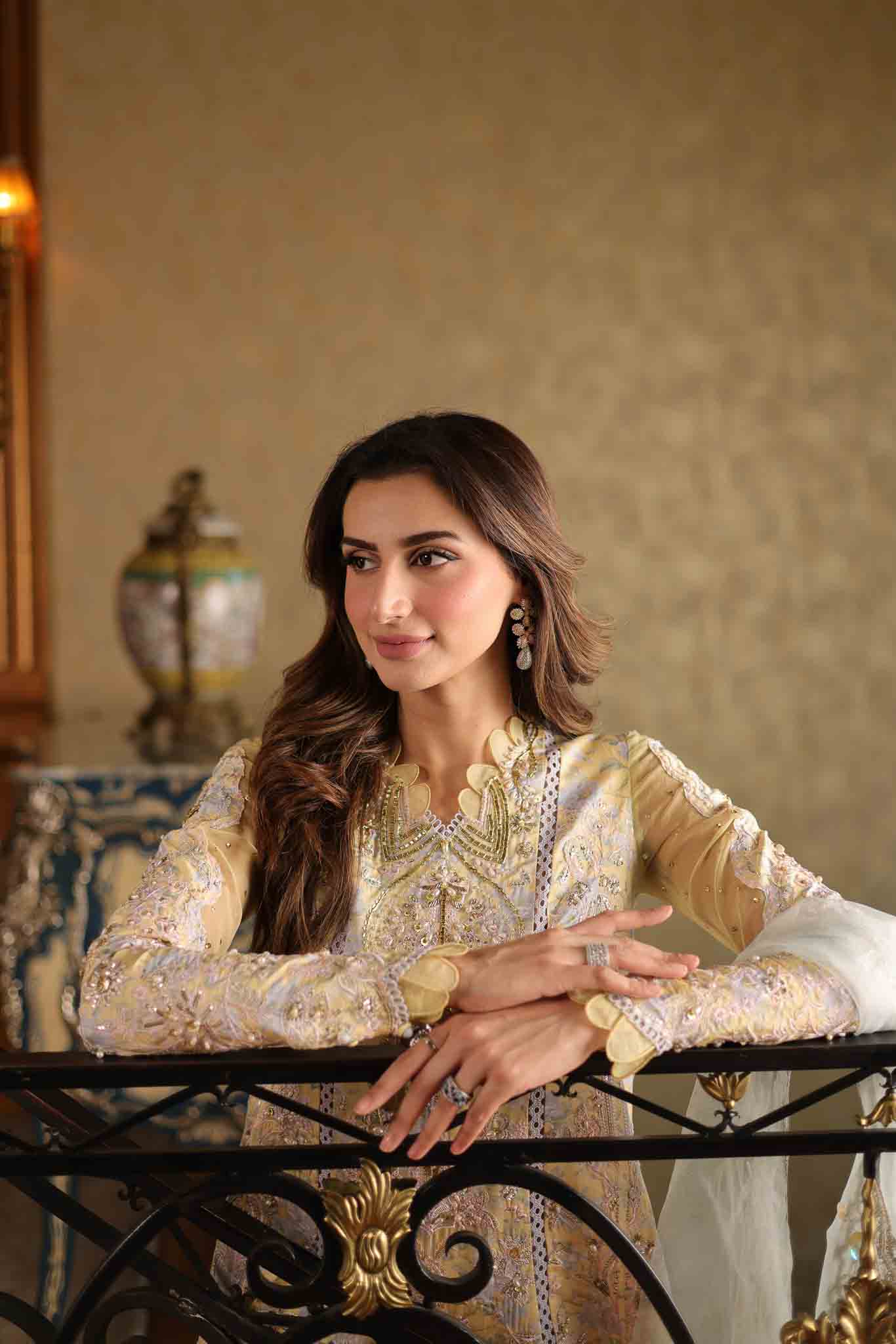 Model wearing pastel yellow embroidered long shirt with ivory dupatta from Mysie By Tahira's Tulip, Pakistani Luxury pret in UK.
