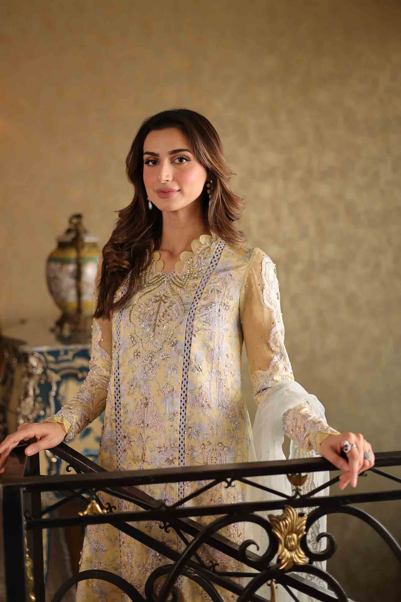 Model wearing pastel yellow embroidered long shirt with ivory dupatta from Mysie By Tahira's Tulip, Pakistani Luxury pret in UK.