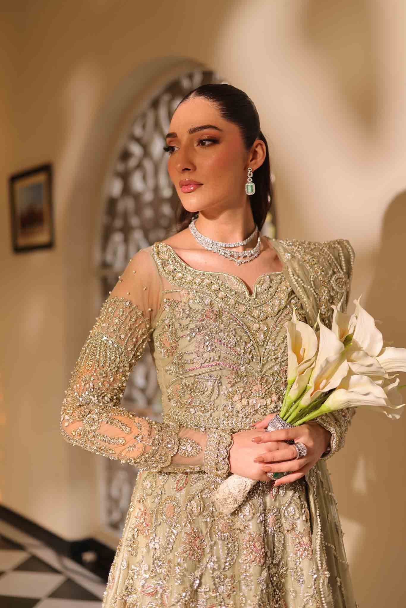 Model wearing pale olive gold gown SNOWFLAKE from Mysie by Tahira, Pakistani luxury pret perfect for weddings, now online in UK.