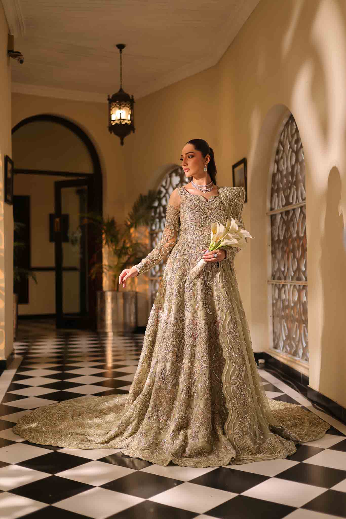 Model wearing pale olive gold gown SNOWFLAKE from Mysie by Tahira, Pakistani luxury pret perfect for weddings, now online in UK.