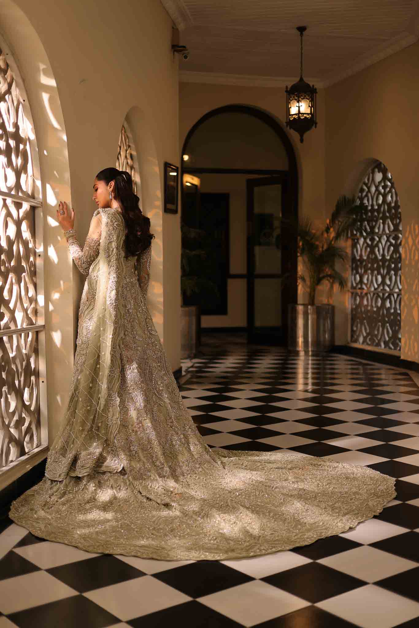 Model wearing pale olive gold gown SNOWFLAKE from Mysie by Tahira, Pakistani luxury pret perfect for weddings, now online in UK.