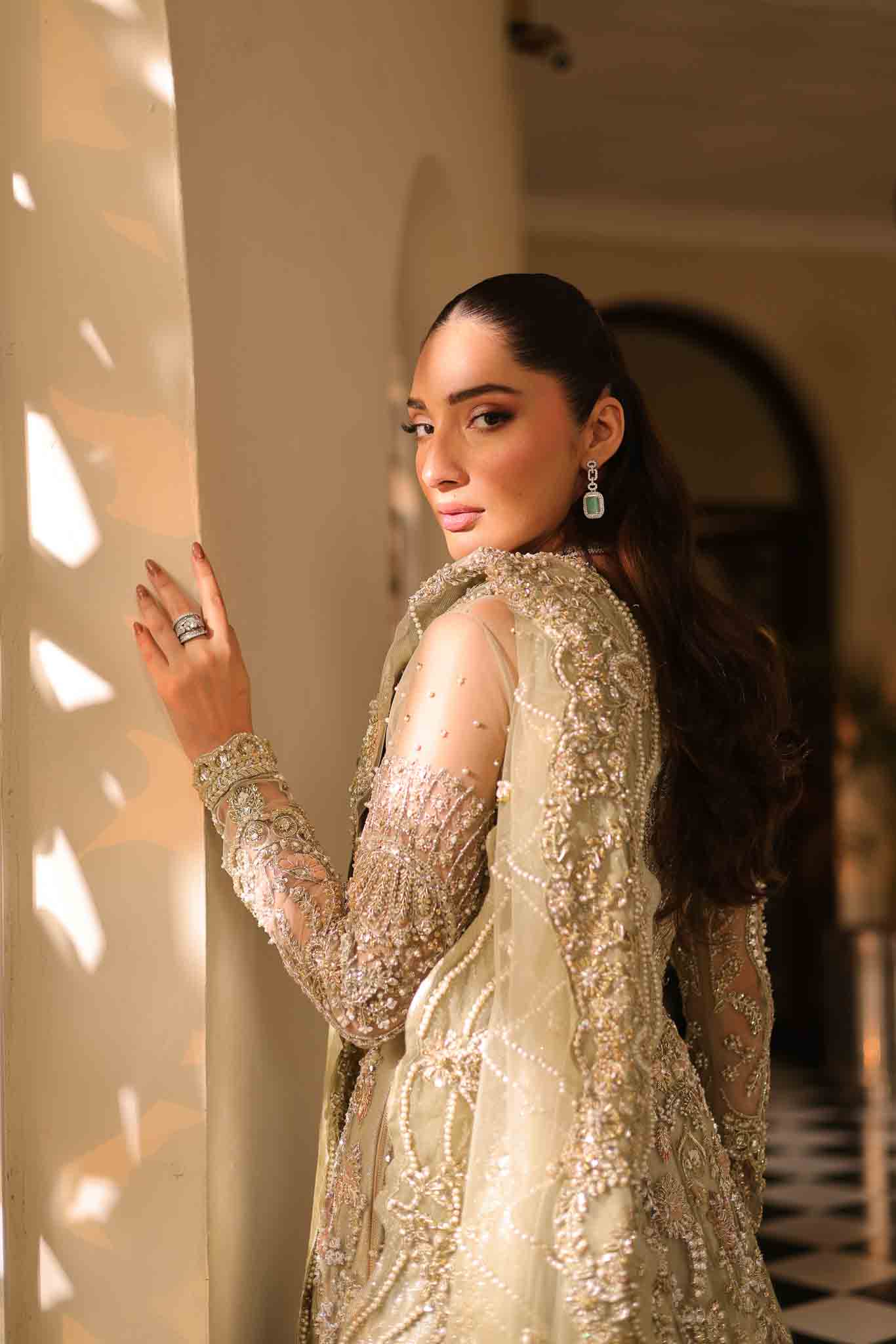 Model wearing pale olive gold gown SNOWFLAKE from Mysie by Tahira, Pakistani luxury pret perfect for weddings, now online in UK.