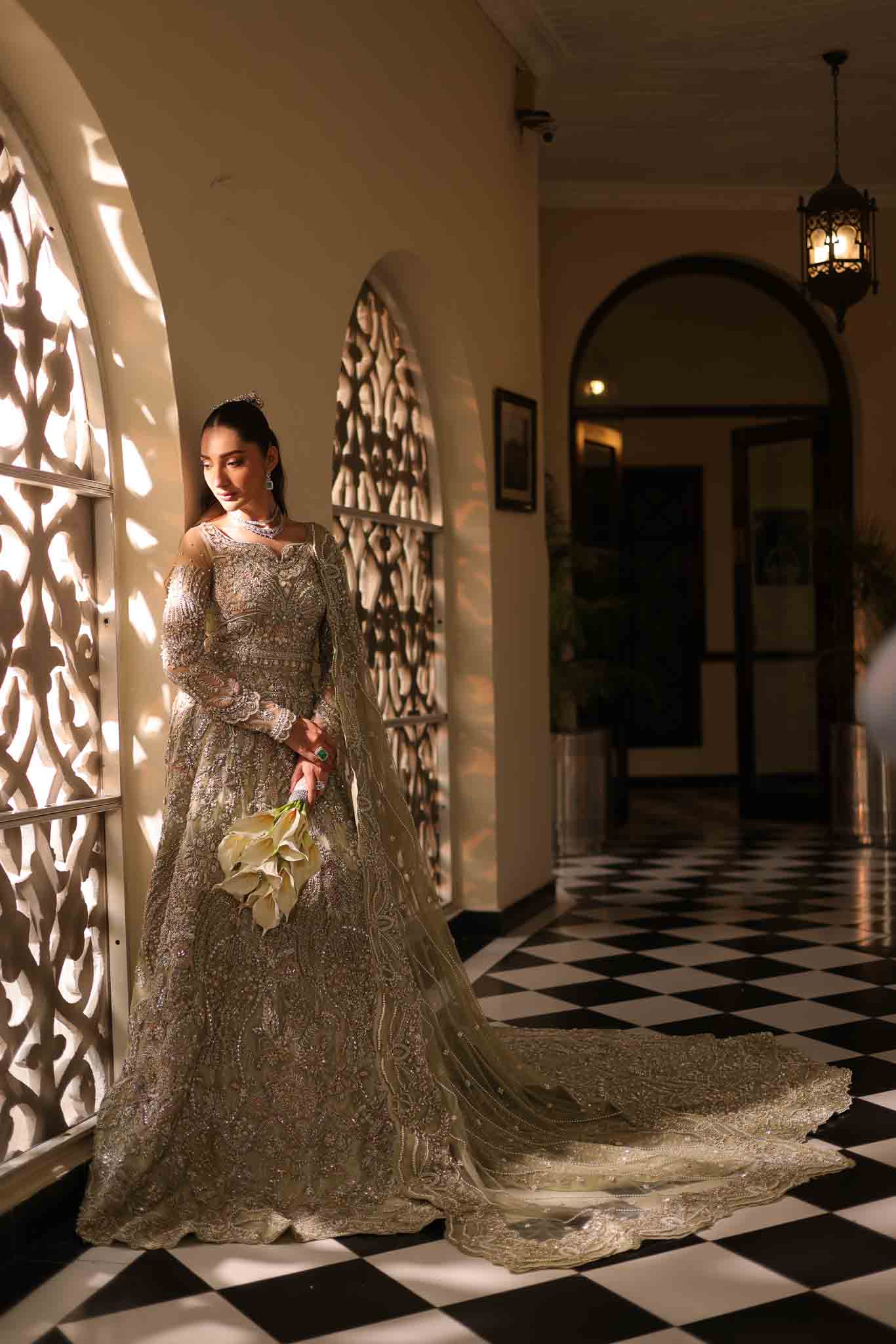Model wearing pale olive gold gown SNOWFLAKE from Mysie by Tahira, Pakistani luxury pret perfect for weddings, now online in UK.