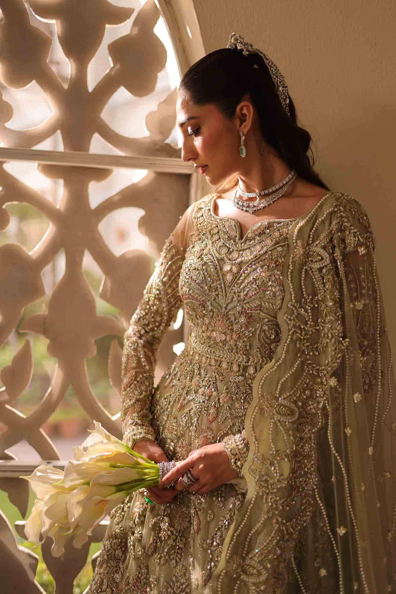 Model wearing pale olive gold gown SNOWFLAKE from Mysie by Tahira, Pakistani luxury pret perfect for weddings, now online in UK.