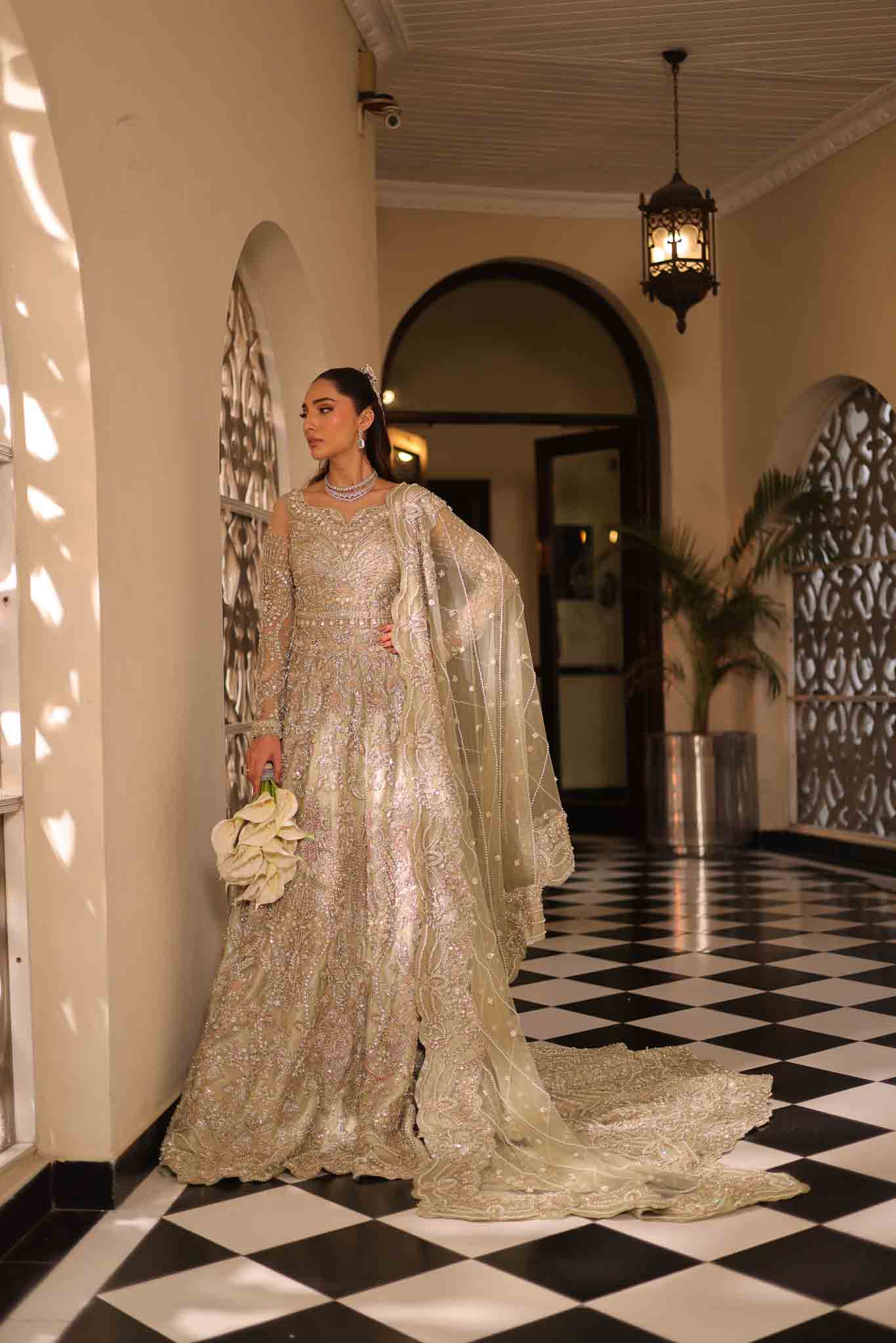Model wearing pale olive gold gown SNOWFLAKE from Mysie by Tahira, Pakistani luxury pret perfect for weddings, now online in UK.