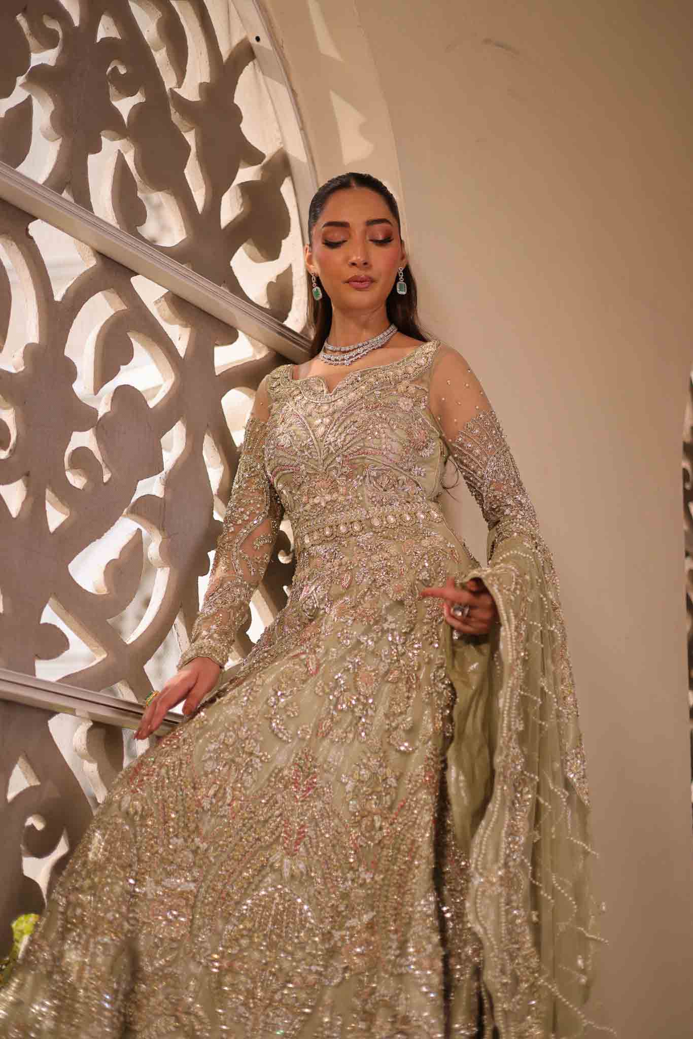 Model wearing pale olive gold gown SNOWFLAKE from Mysie by Tahira, Pakistani luxury pret perfect for weddings, now online in UK.