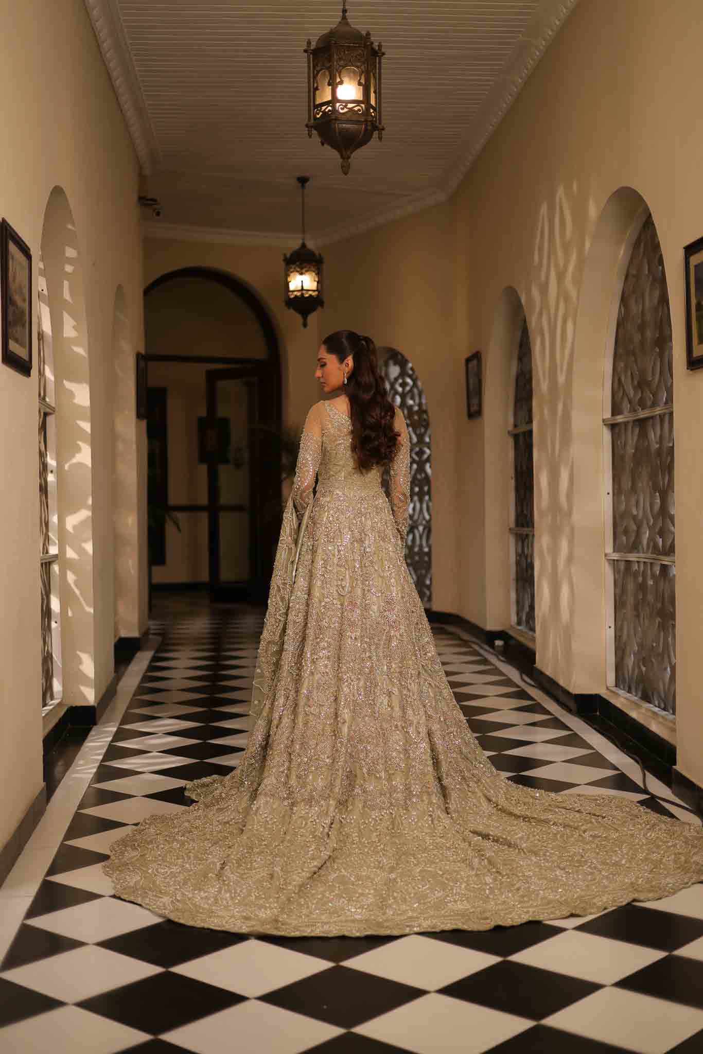 Model wearing pale olive gold gown SNOWFLAKE from Mysie by Tahira, Pakistani luxury pret perfect for weddings, now online in UK.