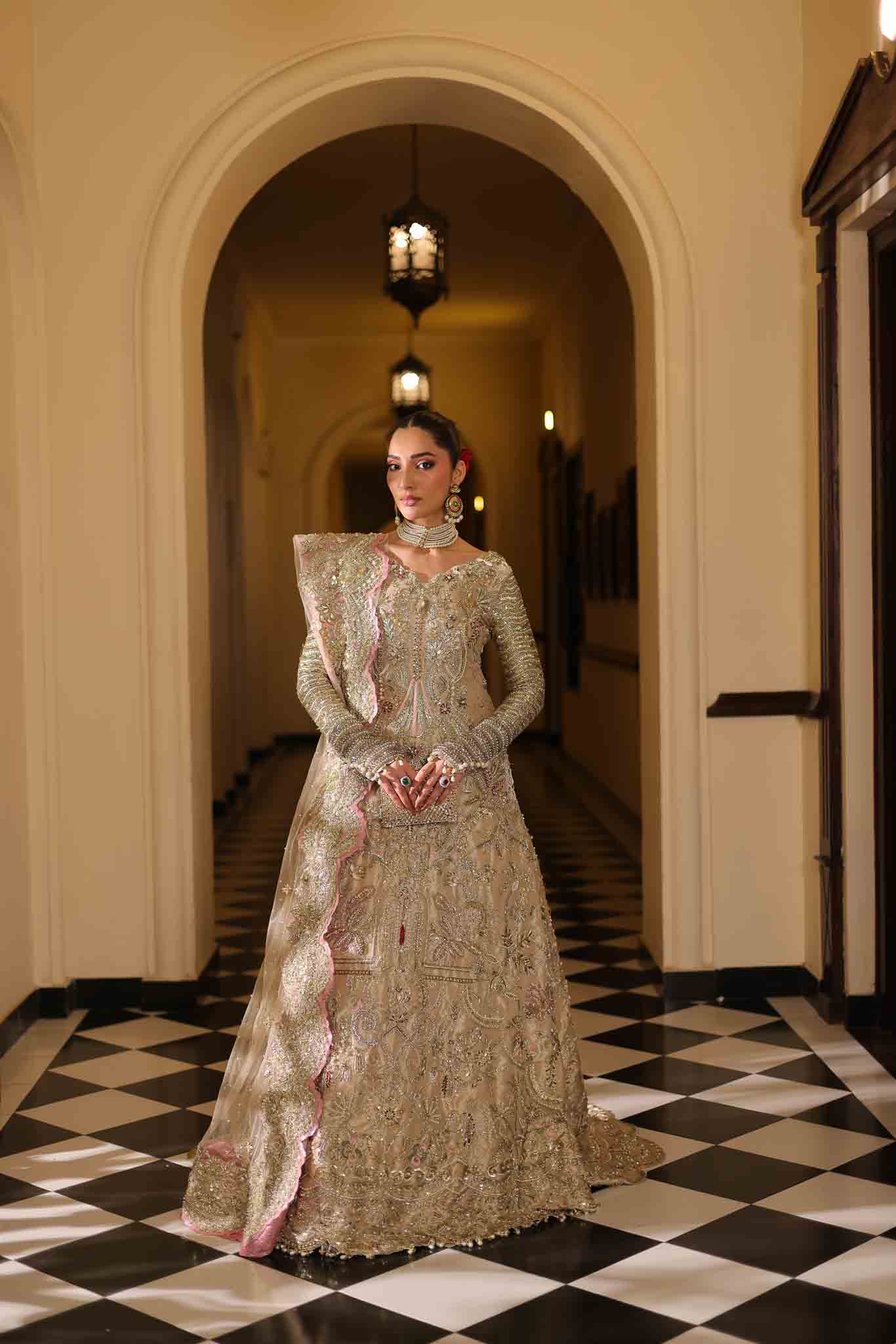 Model wearing champagne gold dress LILA from Mysie by Tahira, intricately embellished Pakistani luxury pret available online in UK.