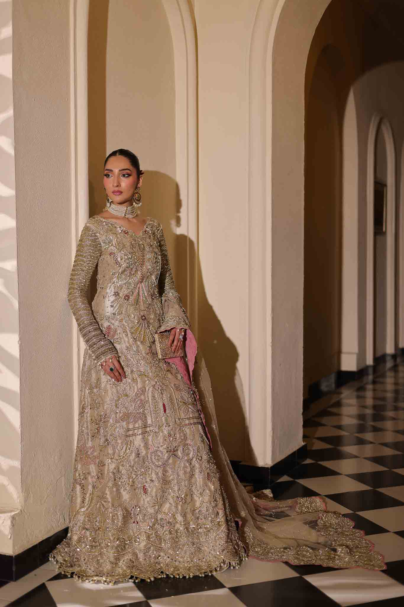 Model wearing champagne gold dress LILA from Mysie by Tahira, intricately embellished Pakistani luxury pret available online in UK.