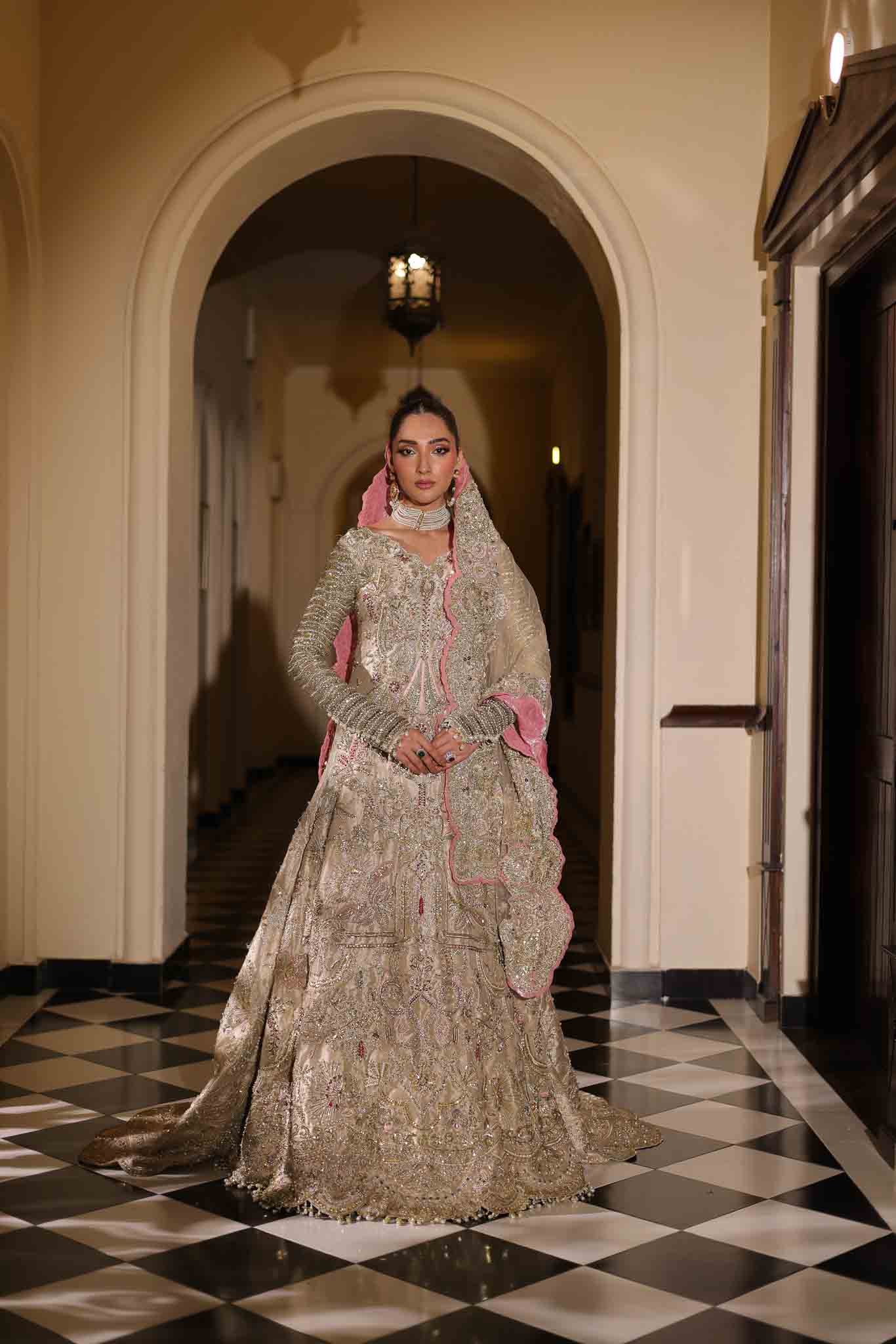 Model wearing champagne gold dress LILA from Mysie by Tahira, intricately embellished Pakistani luxury pret available online in UK.