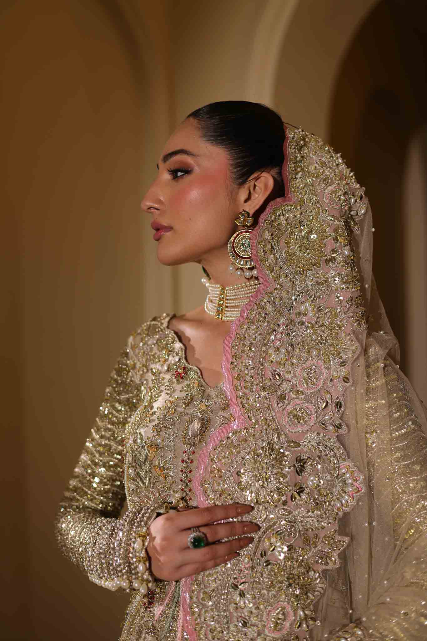 Model wearing champagne gold dress LILA from Mysie by Tahira, intricately embellished Pakistani luxury pret available online in UK.