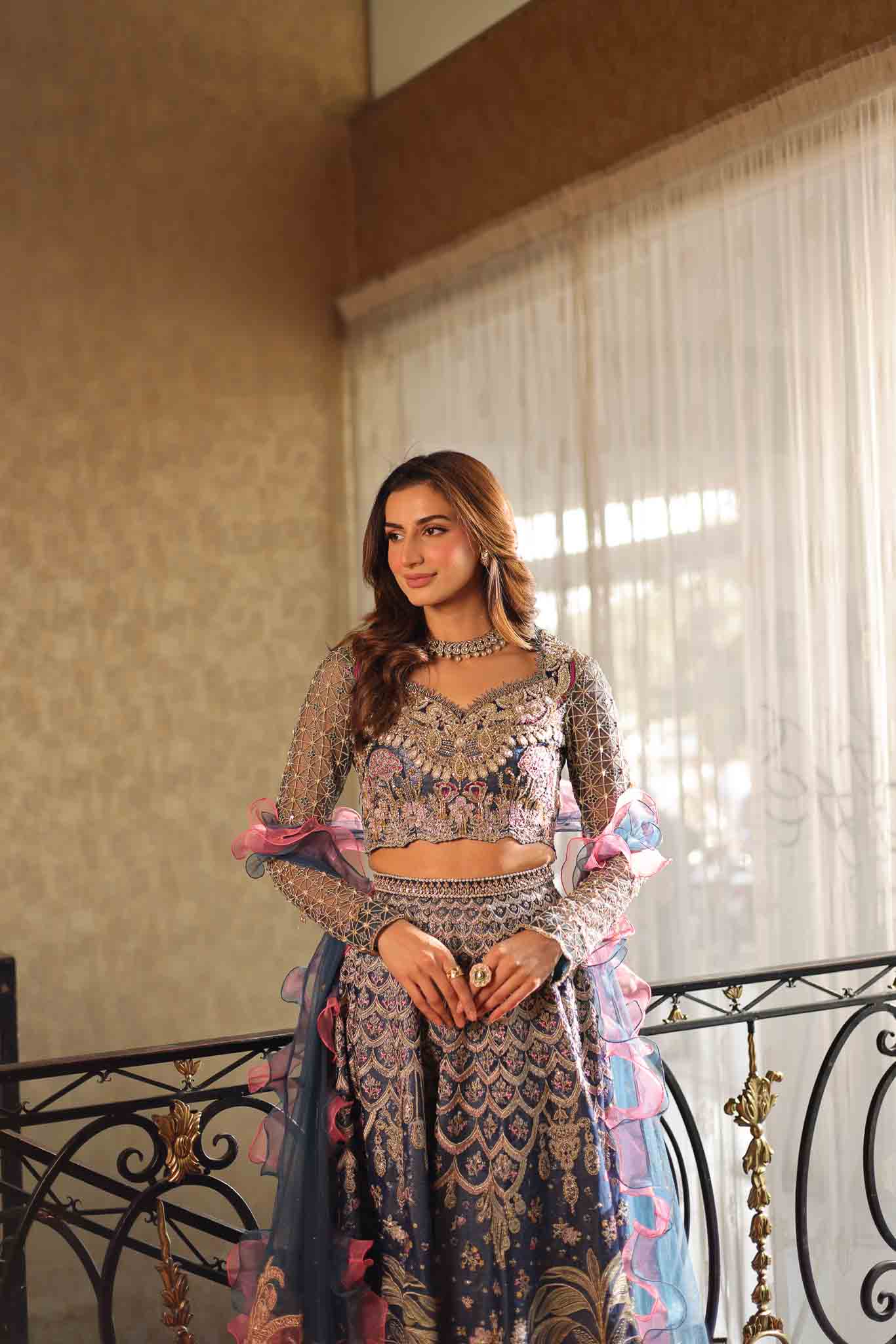 Model wearing blue and pink embellished lehenga choli Stella from Mysie By Tahira Wedding Edits '25, Pakistani luxury pret online in UK.