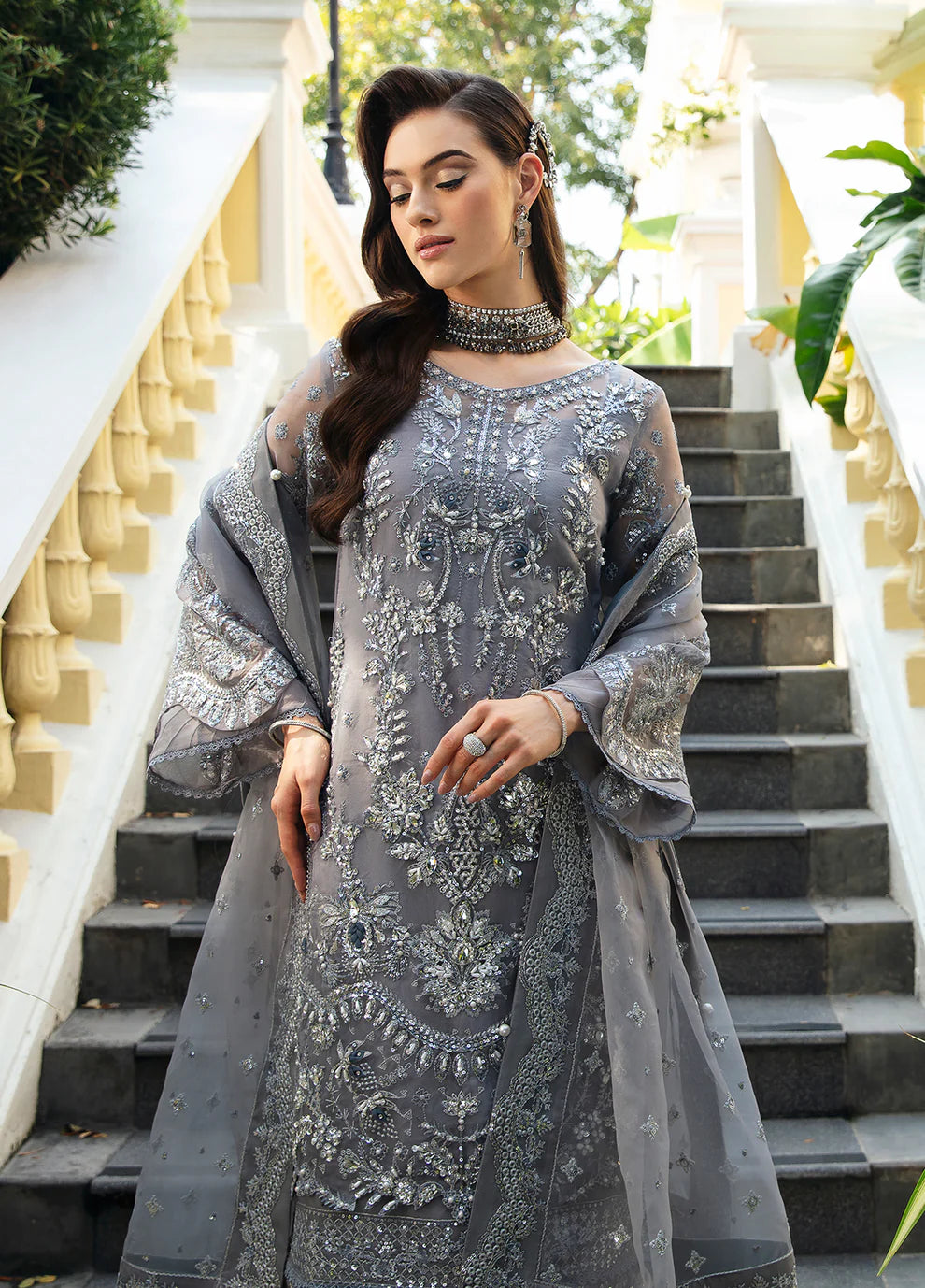 Model wearing Gulaal AVIANA grey embroidered dress, UK Pakistani luxury fashion.
