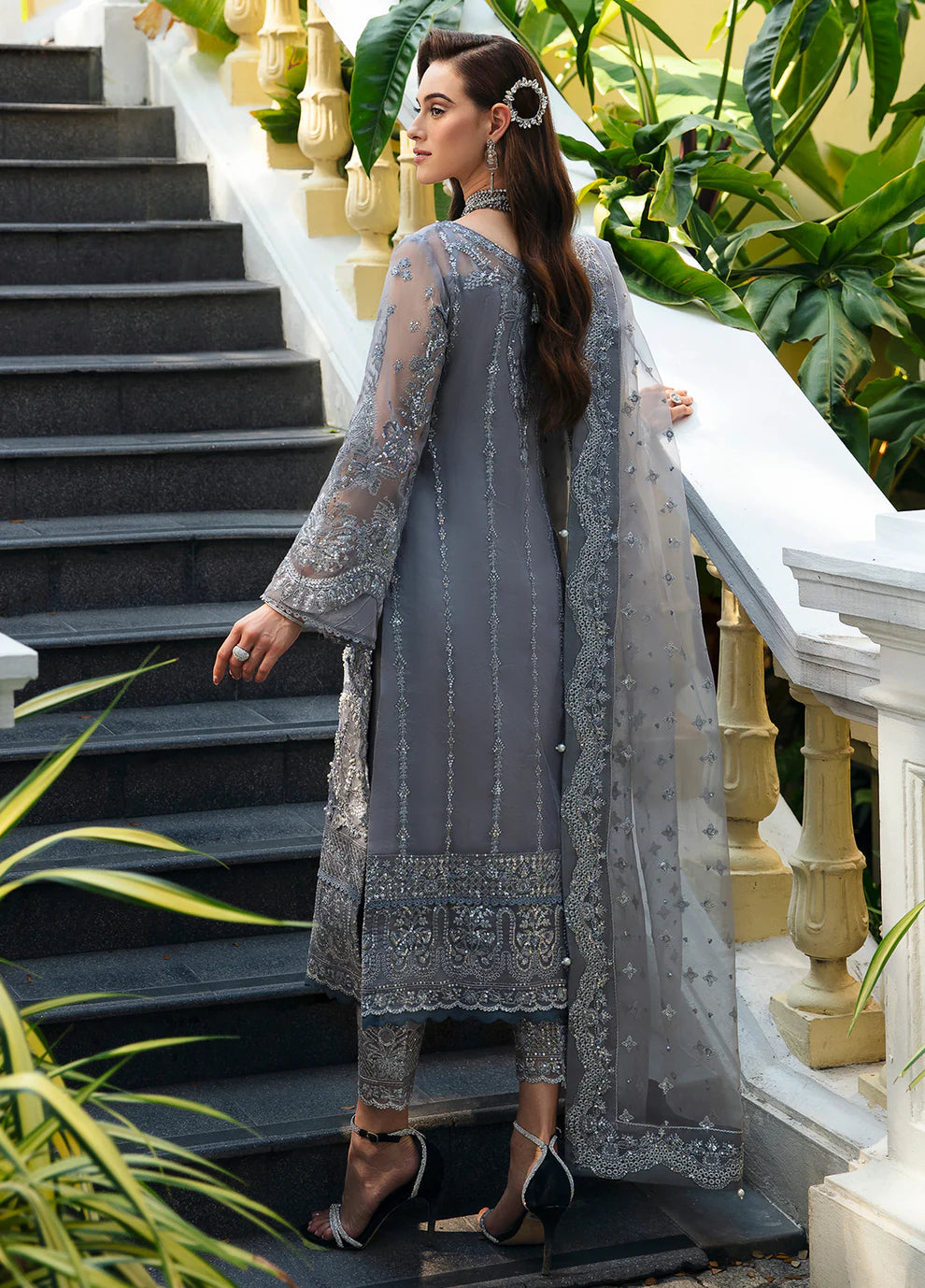 Model wearing Gulaal AVIANA grey embroidered dress, UK Pakistani luxury fashion.