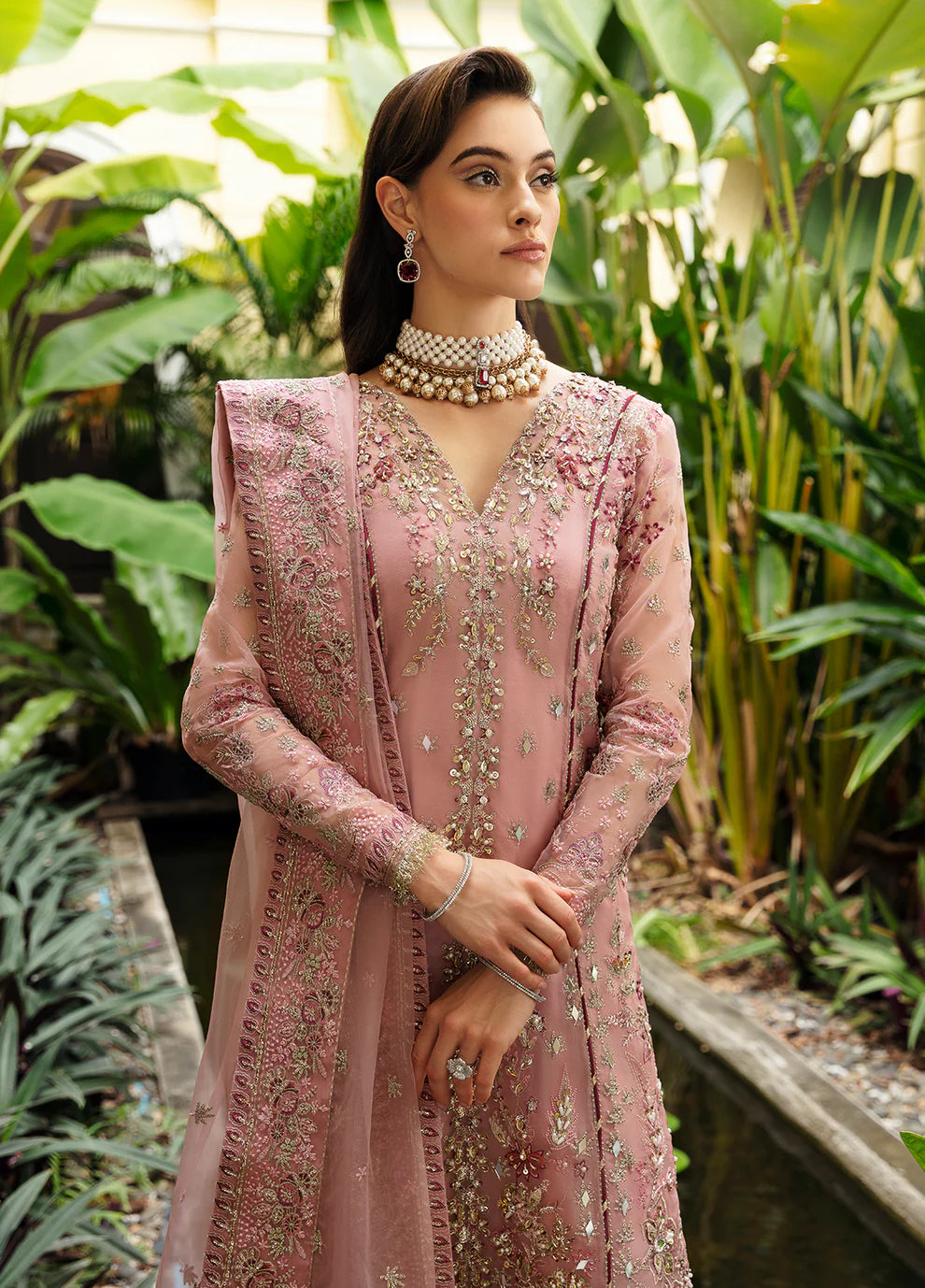 Model wearing Gulaal Luxury Pret pink EVOLETTE dress, elegant Pakistani clothes UK.