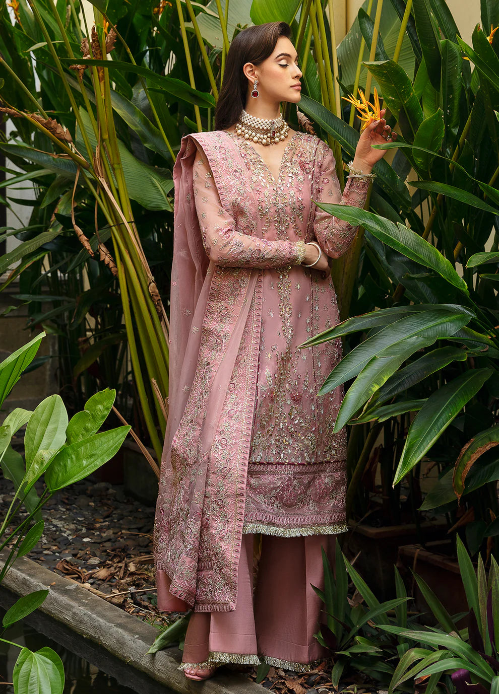 Model wearing Gulaal Luxury Pret pink EVOLETTE dress, elegant Pakistani clothes UK.