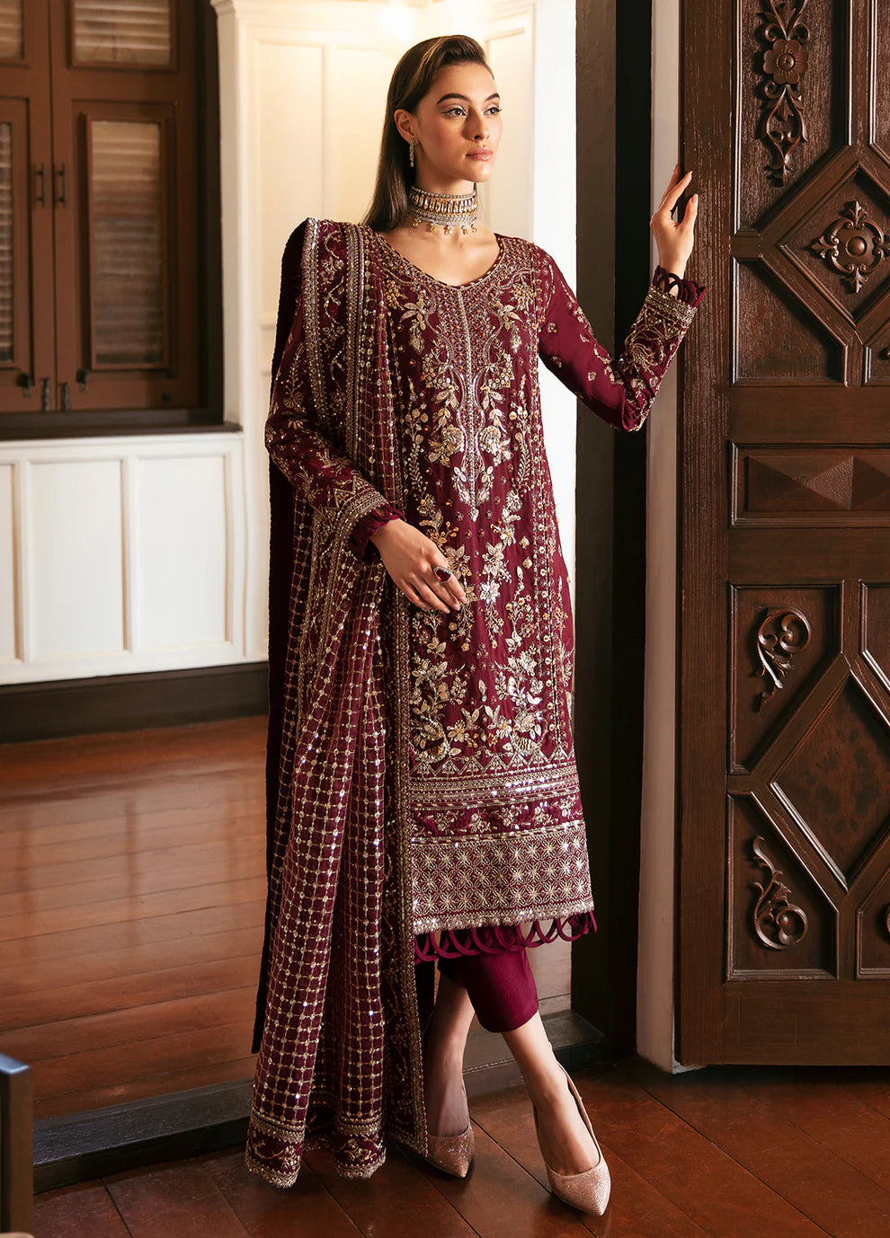 Model in Gulaal VALENTINA dress, maroon with gold embellishments, perfect for Pakistani clothes UK market.