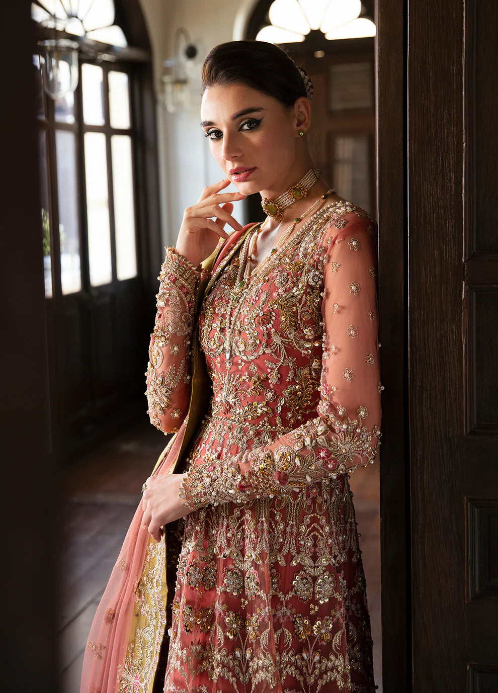 Model wearing Gulaal MARYSE peach and maroon embellished dress, UK Pakistani designer wear.