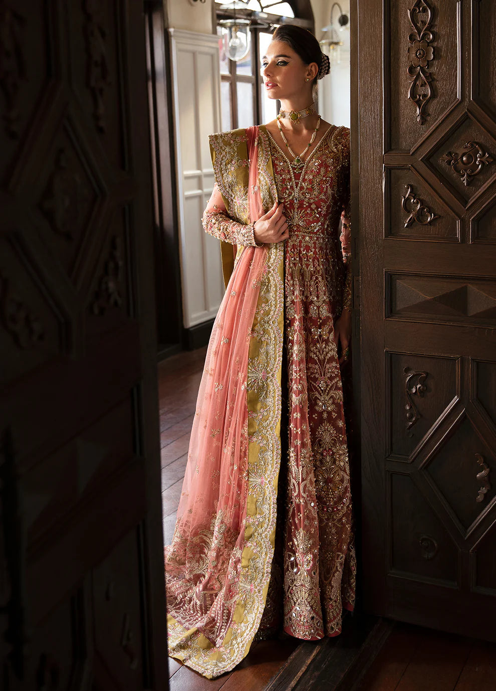 Model wearing Gulaal MARYSE peach and maroon embellished dress, UK Pakistani designer wear.