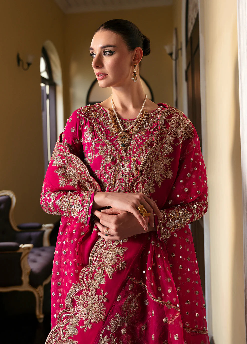 Model wearing Gulaal ROCHELLE pink embroidered dress, luxury Pakistani clothes UK.