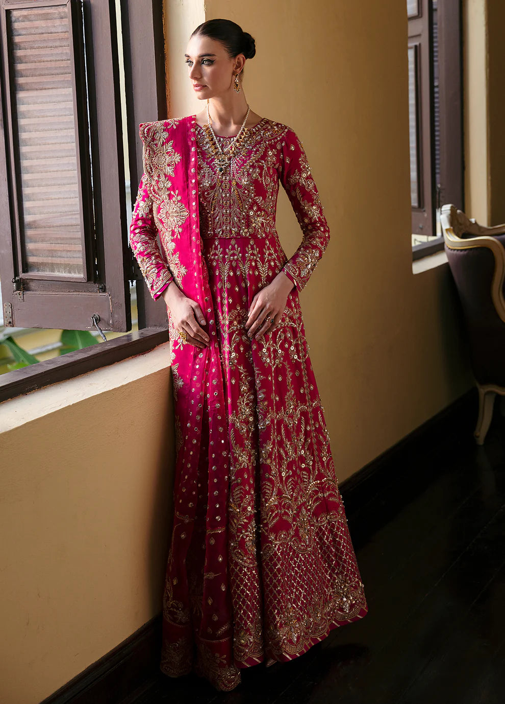 Model wearing Gulaal ROCHELLE pink embroidered dress, luxury Pakistani clothes UK.