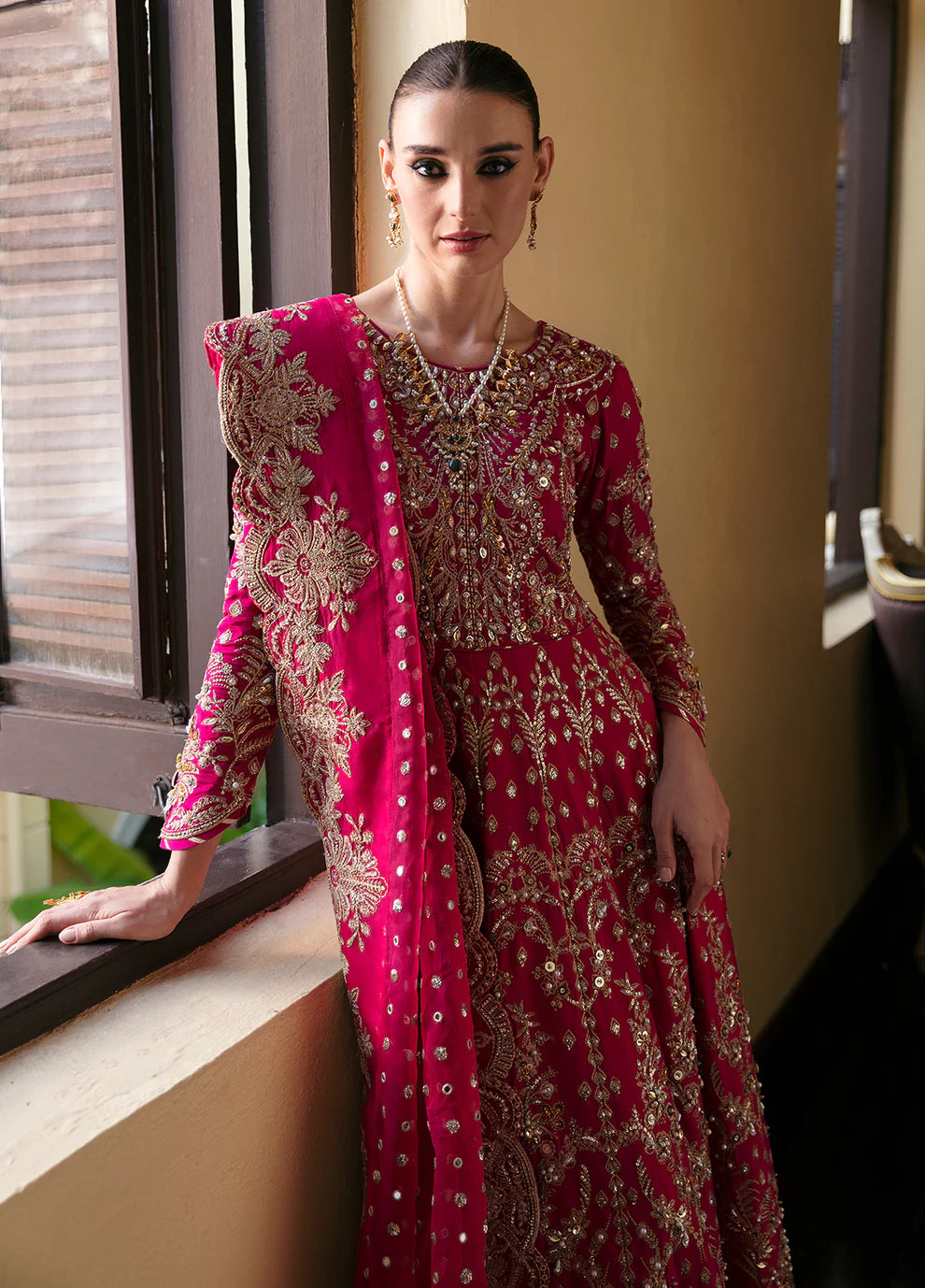 Model wearing Gulaal ROCHELLE pink embroidered dress, luxury Pakistani clothes UK.