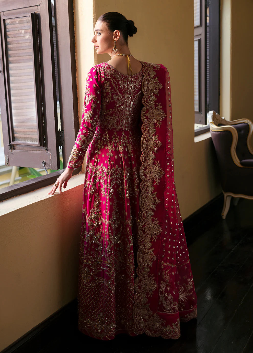 Model wearing Gulaal ROCHELLE pink embroidered dress, luxury Pakistani clothes UK.
