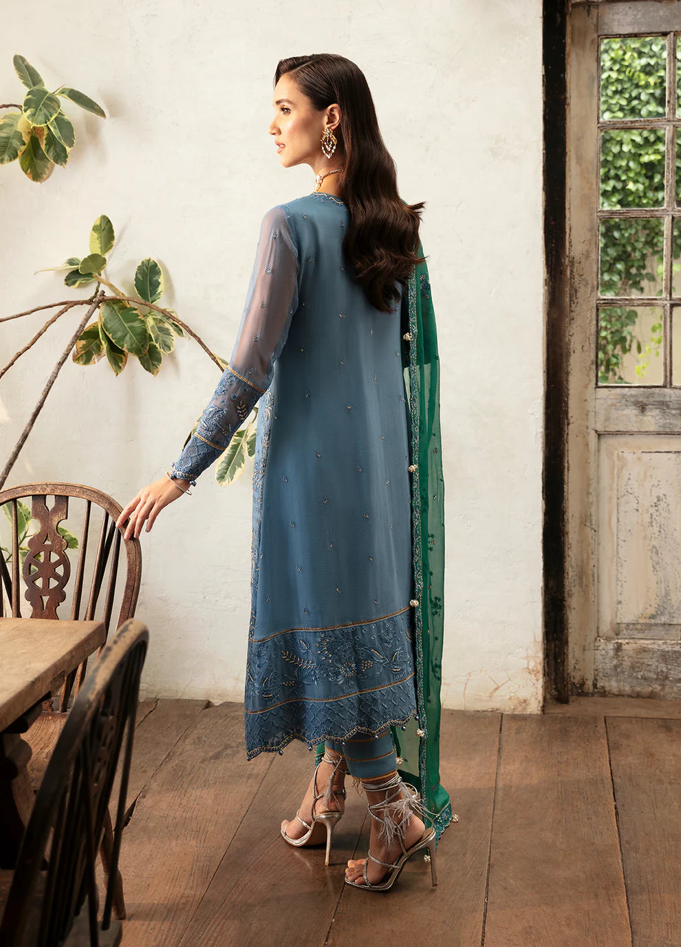 Model wearing Gulaal Helia blue chiffon Eid dress, Suffuse embroidery, Pakistani clothes UK.