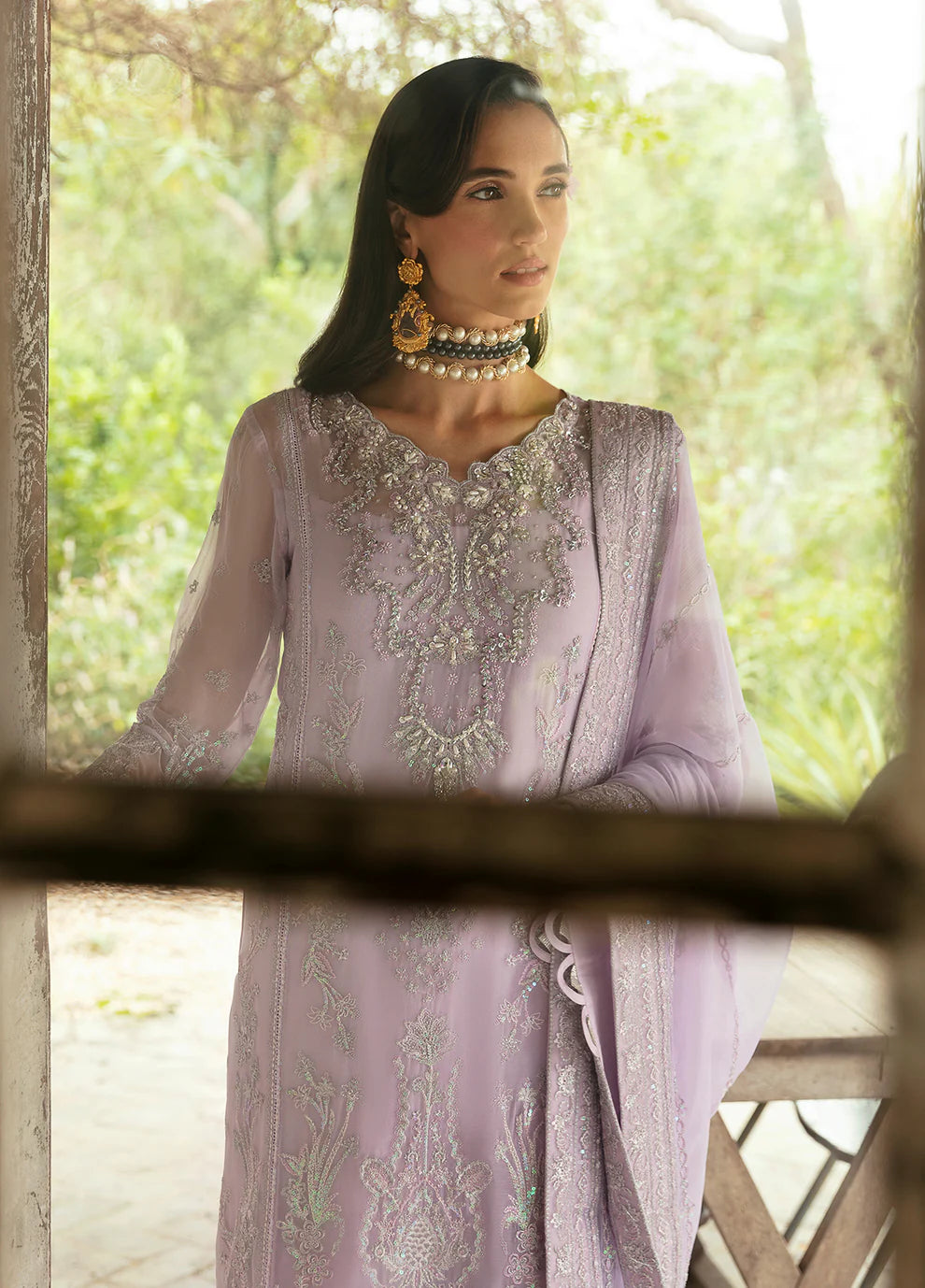 Model wearing Gulaal Viola lavender embroidered Eid dress, Suffuse accents, luxe Pakistani clothes UK.