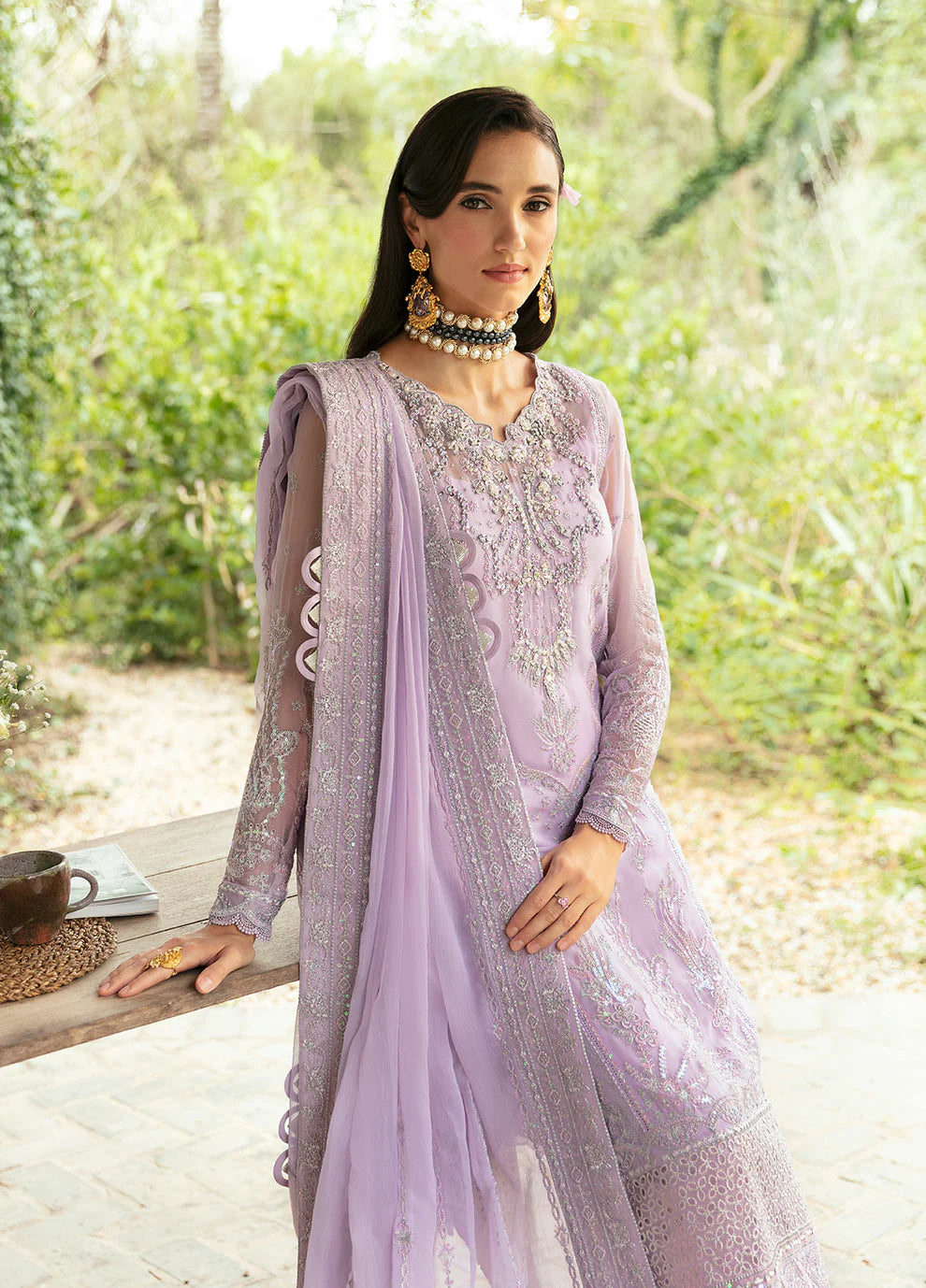 Model wearing Gulaal Viola lavender embroidered Eid dress, Suffuse accents, luxe Pakistani clothes UK.