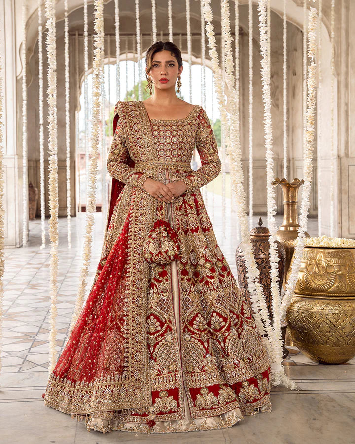 Model wearing deep red and gold bridal dress Juri by Faiza Saqlain, Pakistani luxury pret online in UK for weddings.