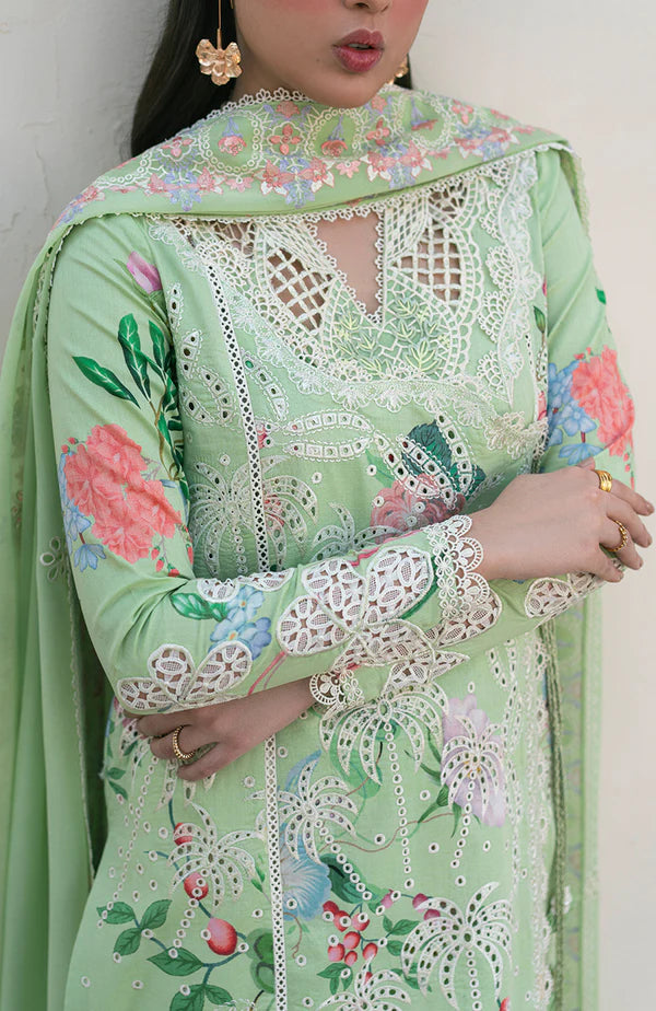 Model wearing mint green embroidered dress with floral detailing and lace hem from Soraya Noa Summer Casual Pret 2025 Willow. Pakistani clothes online UK.