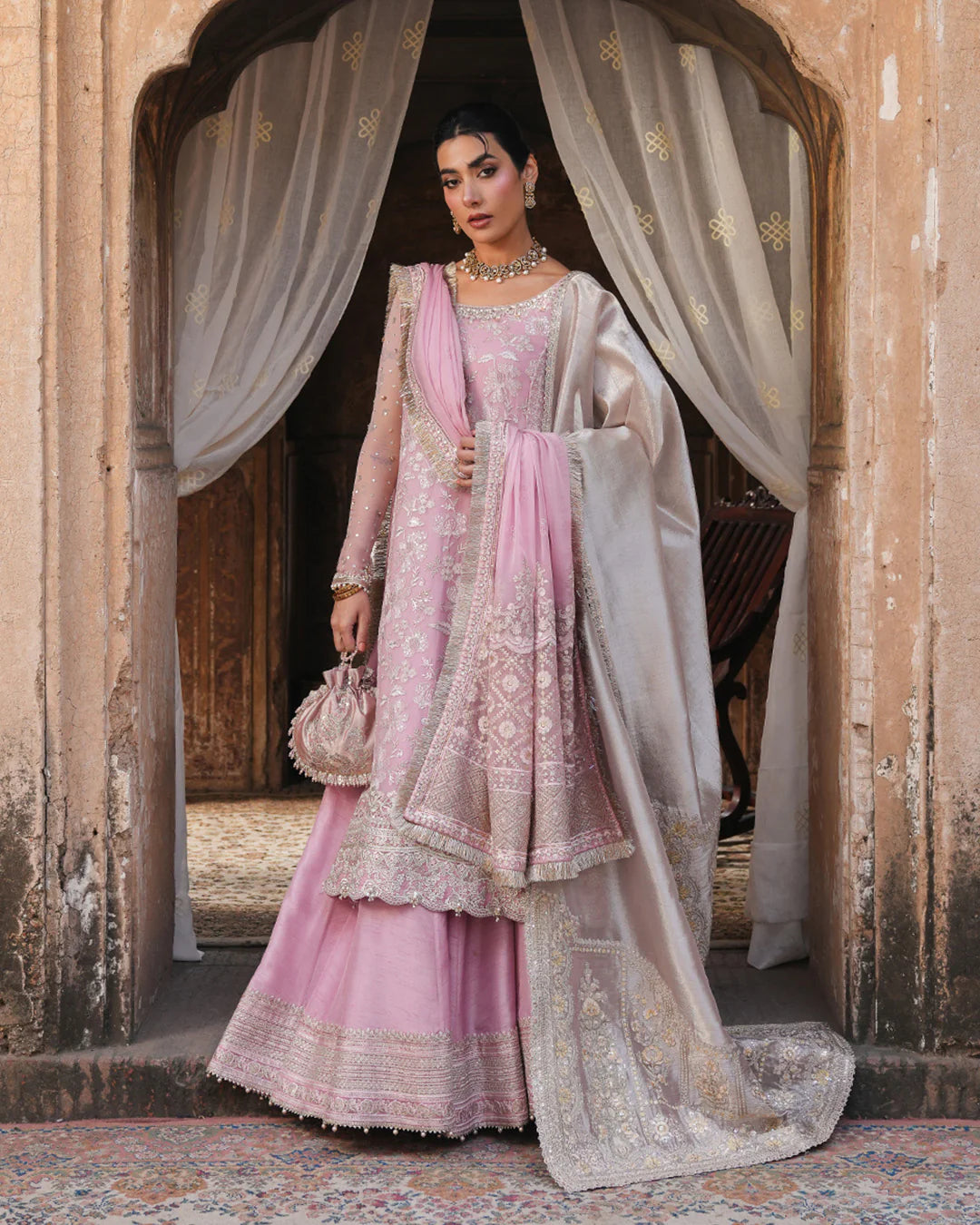 Model wearing blush pink Faiza Saqlain Vemita outfit with embellished detailing and dupatta, perfect for Pakistani luxury pret in the UK.