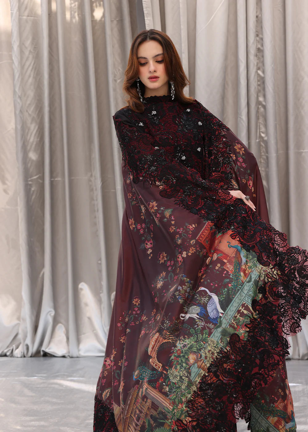 Model wearing black and deep red embroidered long dress with printed maroon dupatta from Musferah Saad Moonlit Glam, Pakistani Luxury pret in UK.