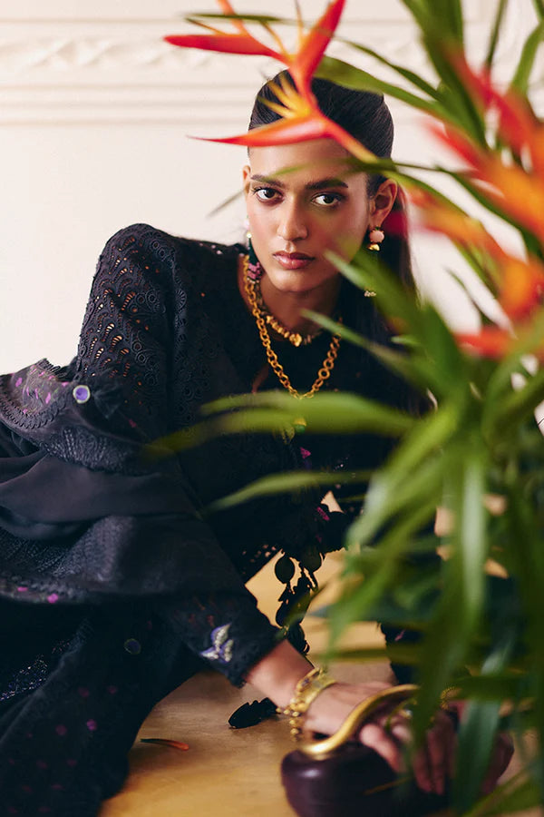 Model wearing black embroidered dress from Suffuse Casual Pret 2025 Leyla. Pakistani luxury pret and Pakistani clothes online in UK.